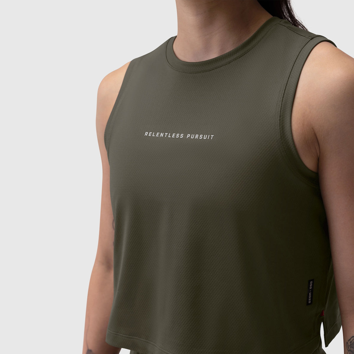 AeroSilver® Tank Top in olive worn by model, front view with 'Relentless Pursuit' text