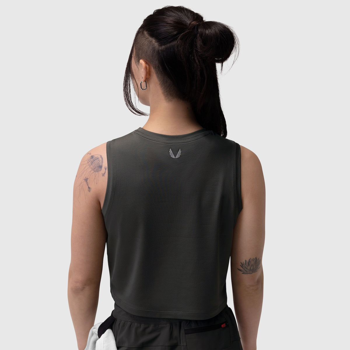 Black AeroSilver® tank top on model, back view, showing sleeveless design and small logo