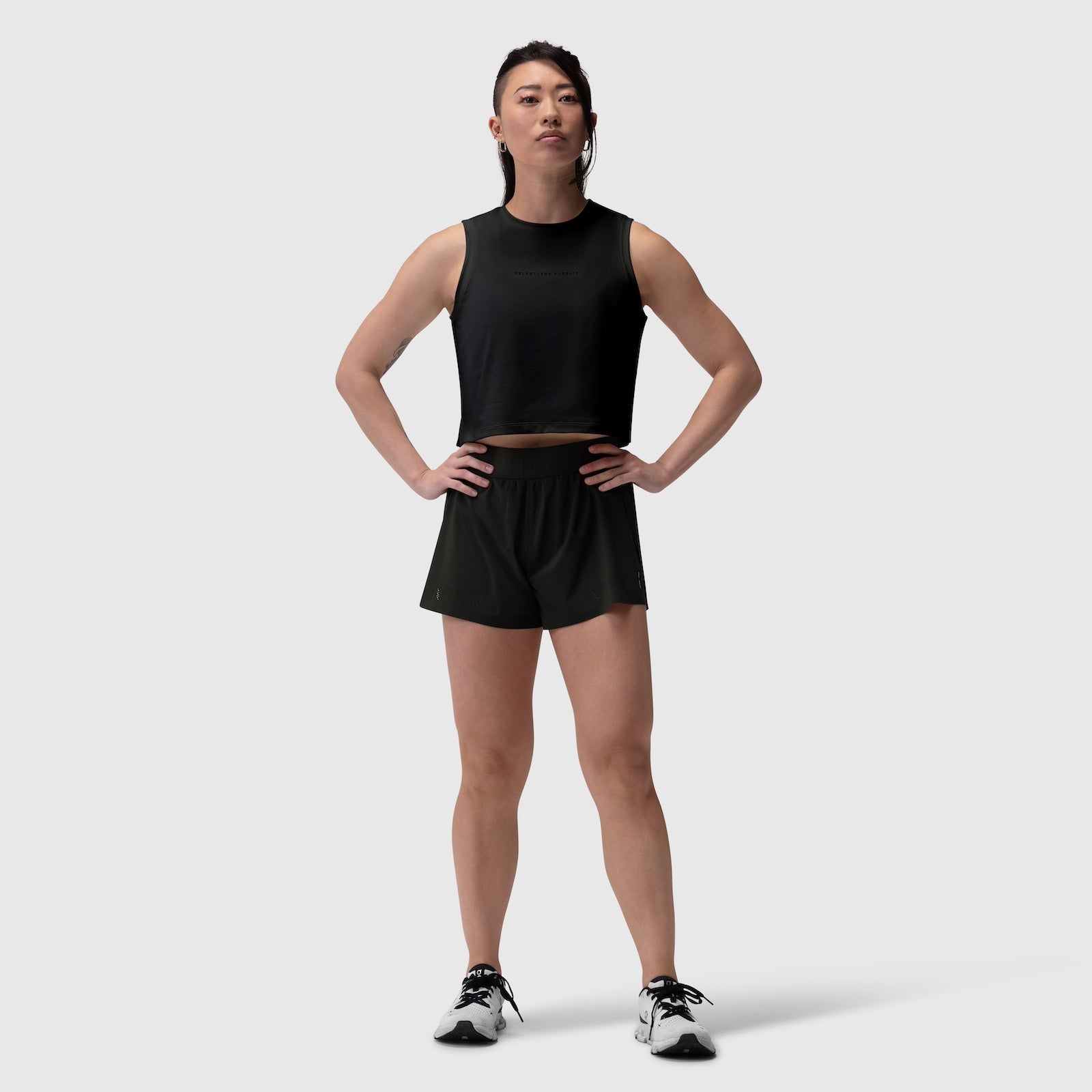 Black Aerotex Side Split Run Short worn by model in standing pose, front view
