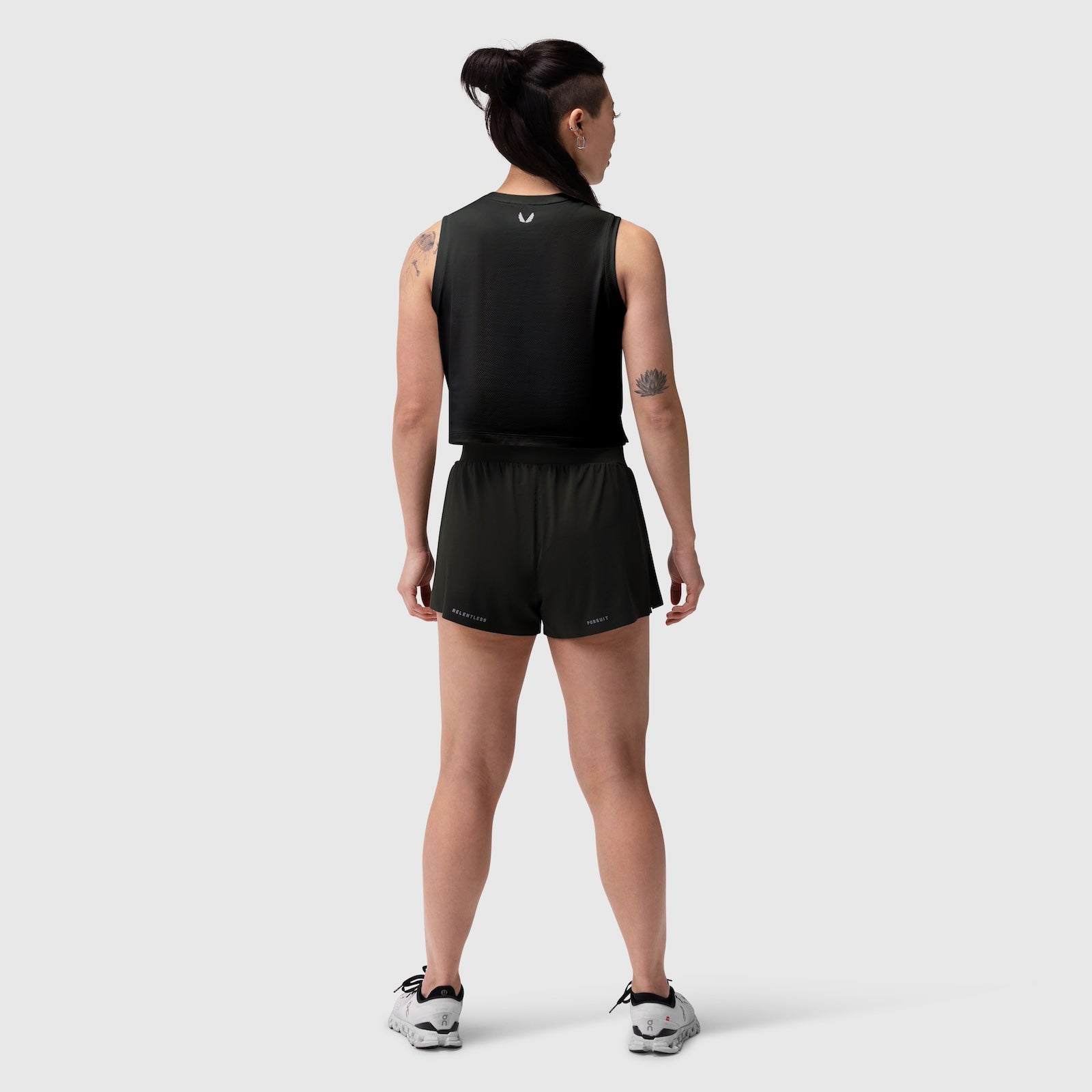 Aerotex Side Split Run Short in black, rear view on model