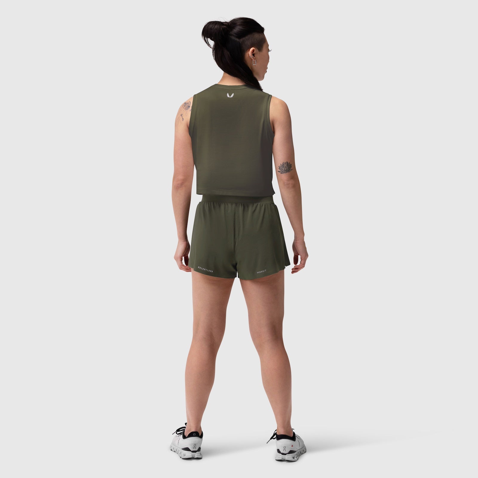 Aerotex Side Split Run Short in olive, worn by model from back view