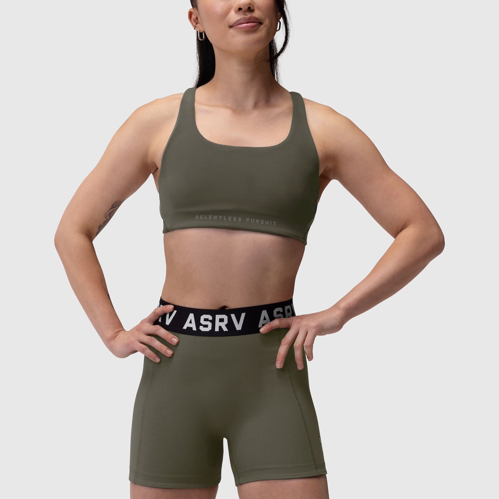 Lycra Hybrid Sports Bra in olive, worn by model with matching shorts, front view