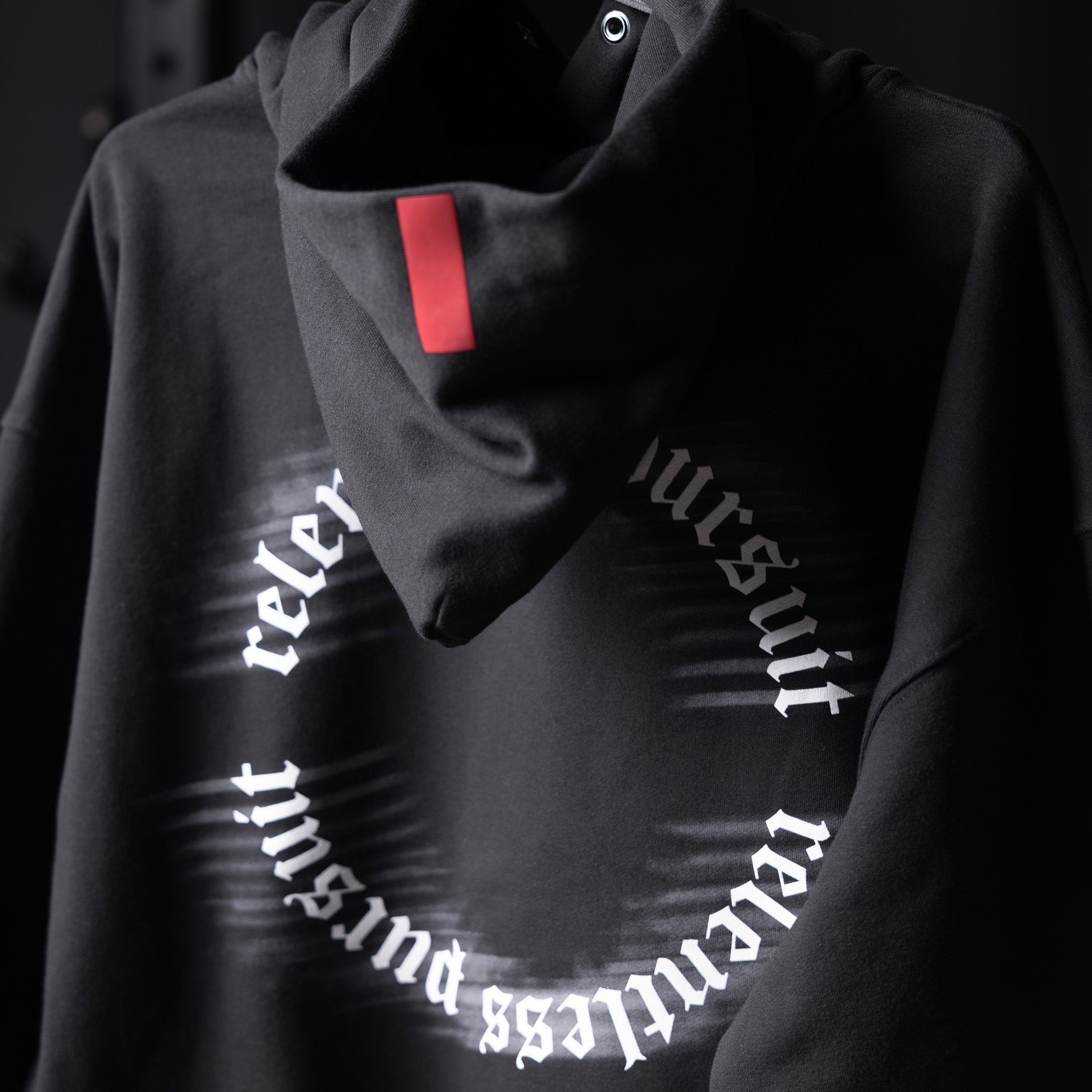 Tech-Terry Zip Pocket Hoodie in black with reflective RP Blur text, worn by model