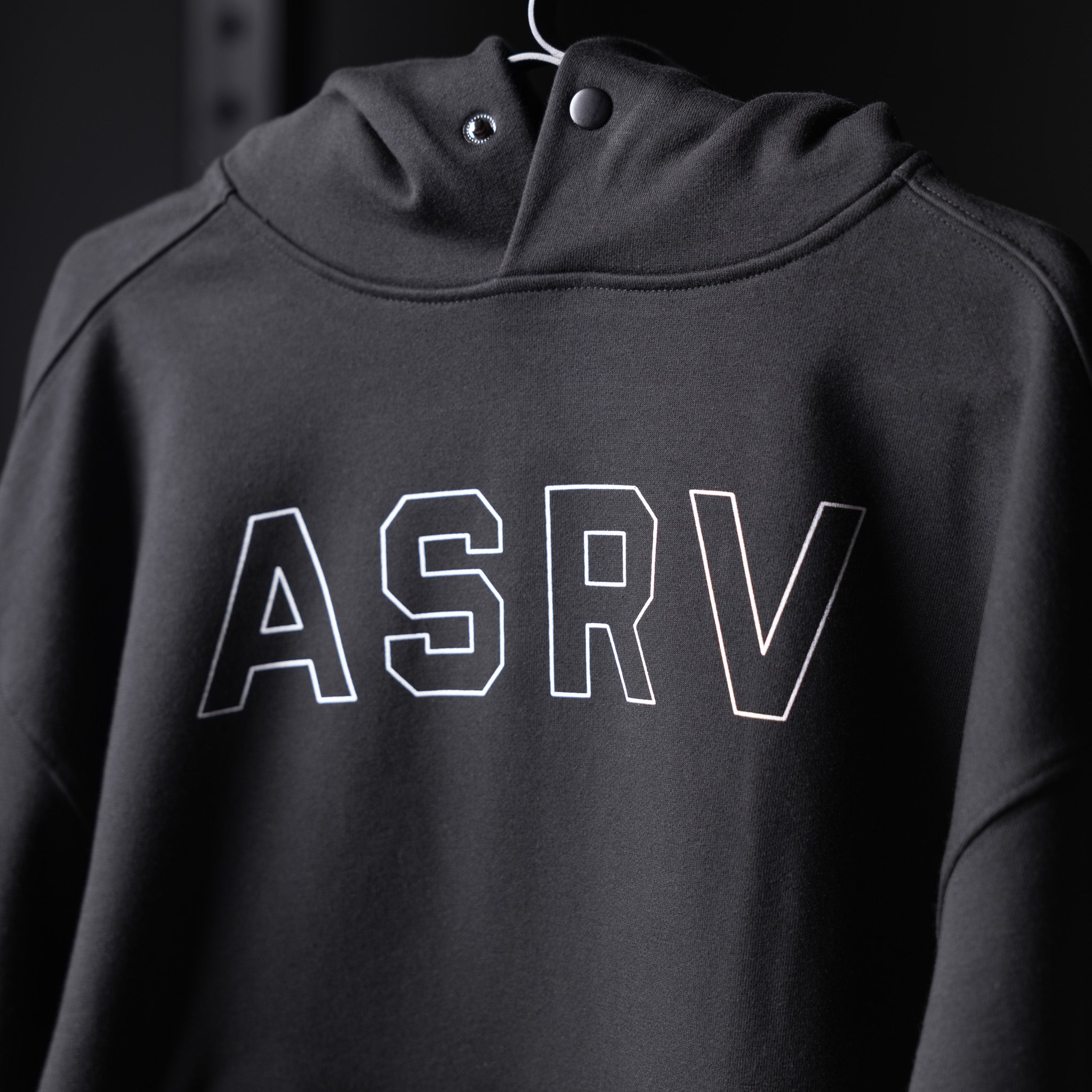 Flatlay Tech-Terry Zip Pocket Hoodie in black with white ASRV outline lettering