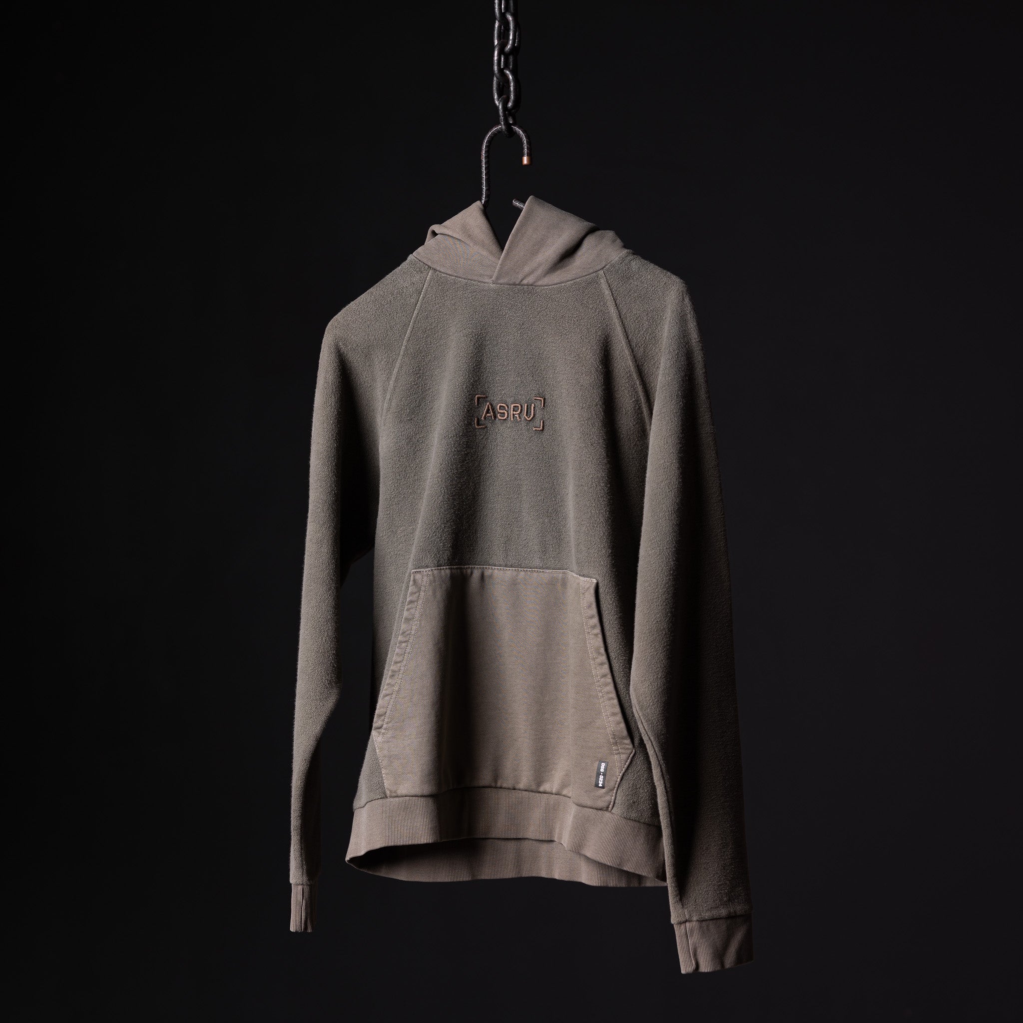 SS'20 Reverse Weave Hoodie in taupe, displayed on hanger against black background