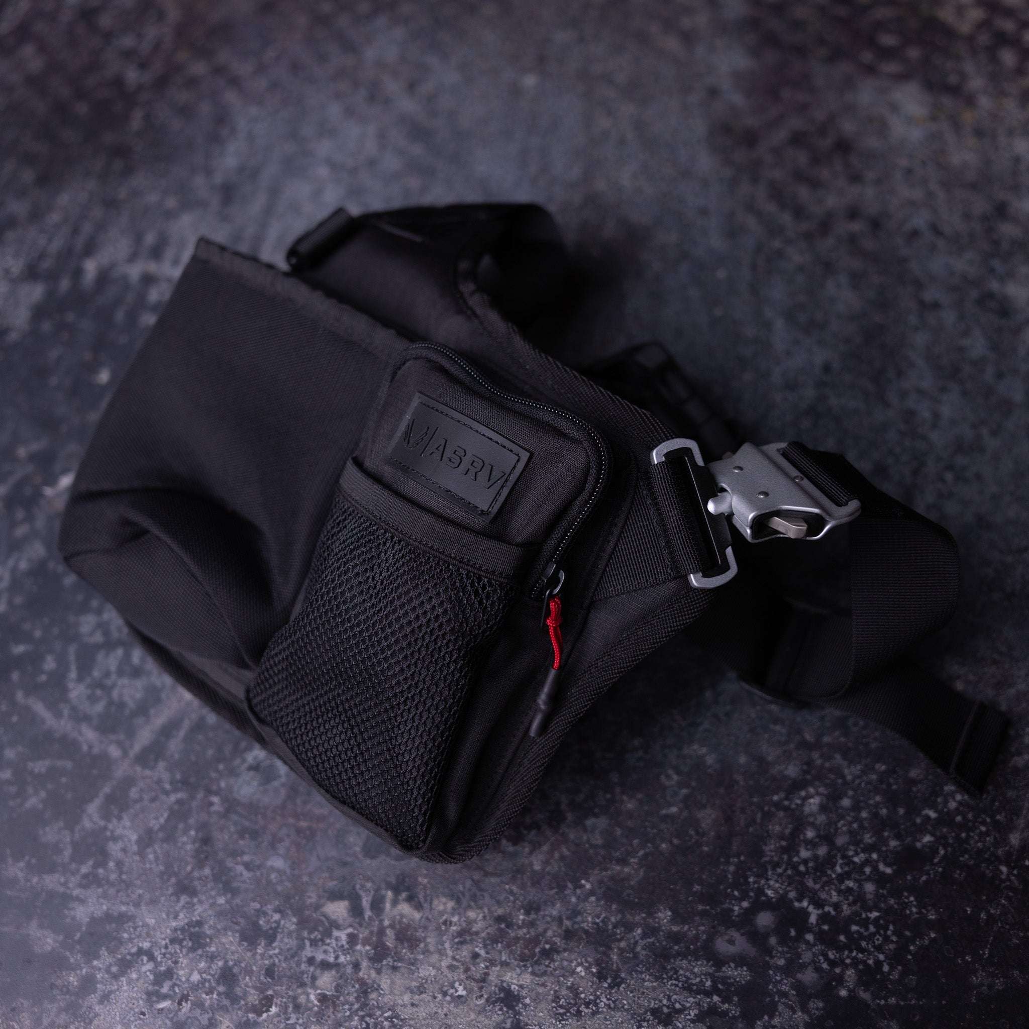 Flatlay of SM'23 Crossbody bag in black, angled view