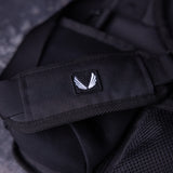 SM'23 Crossbody in black, close-up detail of logo patch