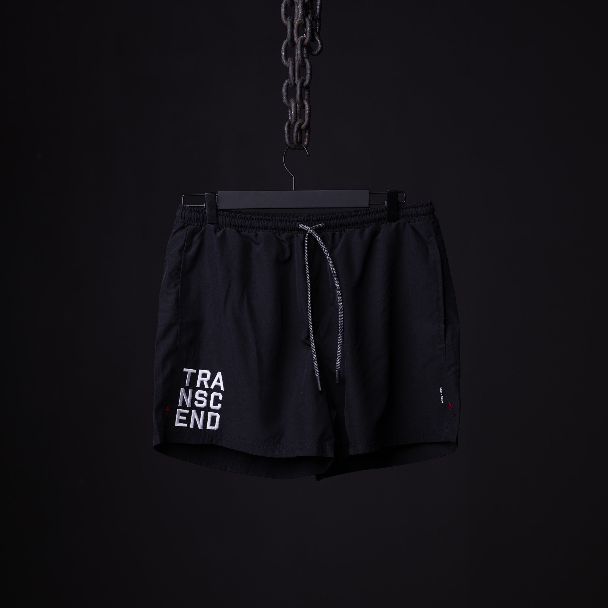 flatlay SP'22 Vintage 5" Training Short in black with "TRANSCEND" text, front view