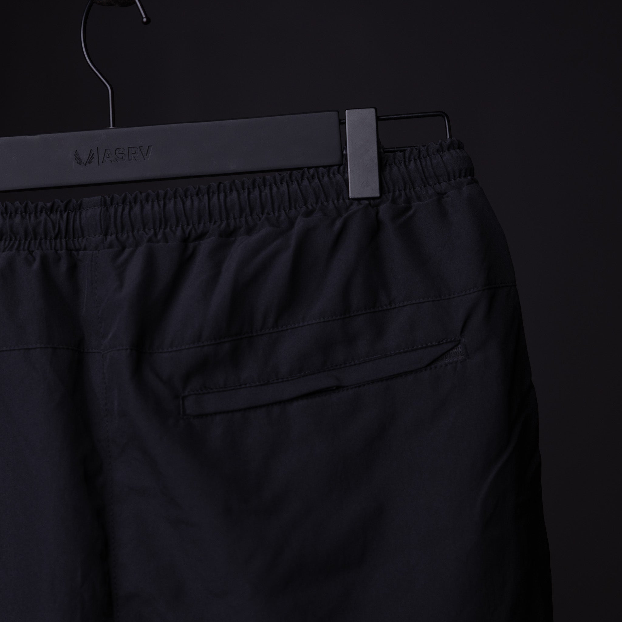 SP'22 Vintage 5" Training Short in black on hanger, detail view