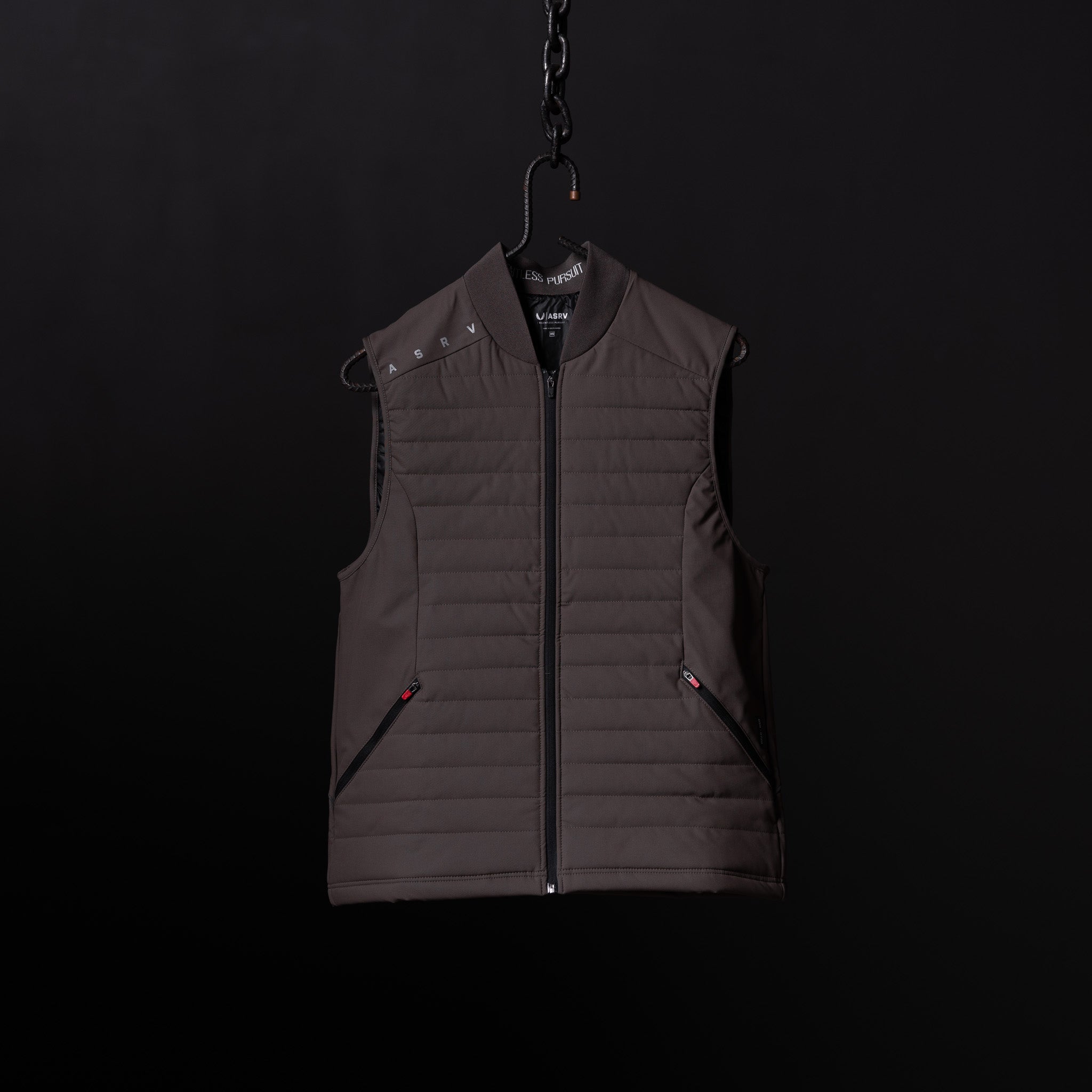 SP'23 Waterproof Run Vest in charcoal gray, displayed on hanger against dark background