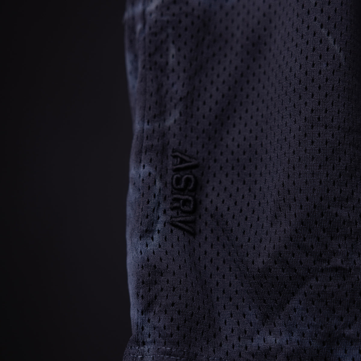 SM'22 Tie Dye Short in navy worn on model, side detail view showing fabric texture