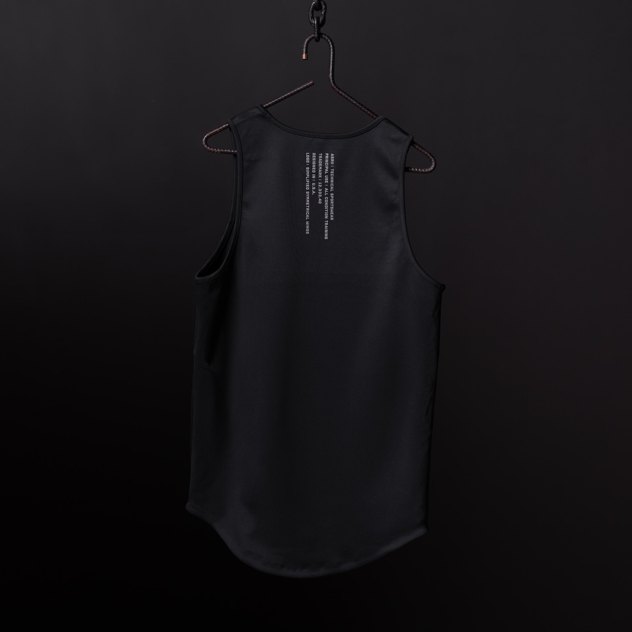 SP'20 Mesh Utility Tank in black, hung on hanger against dark background