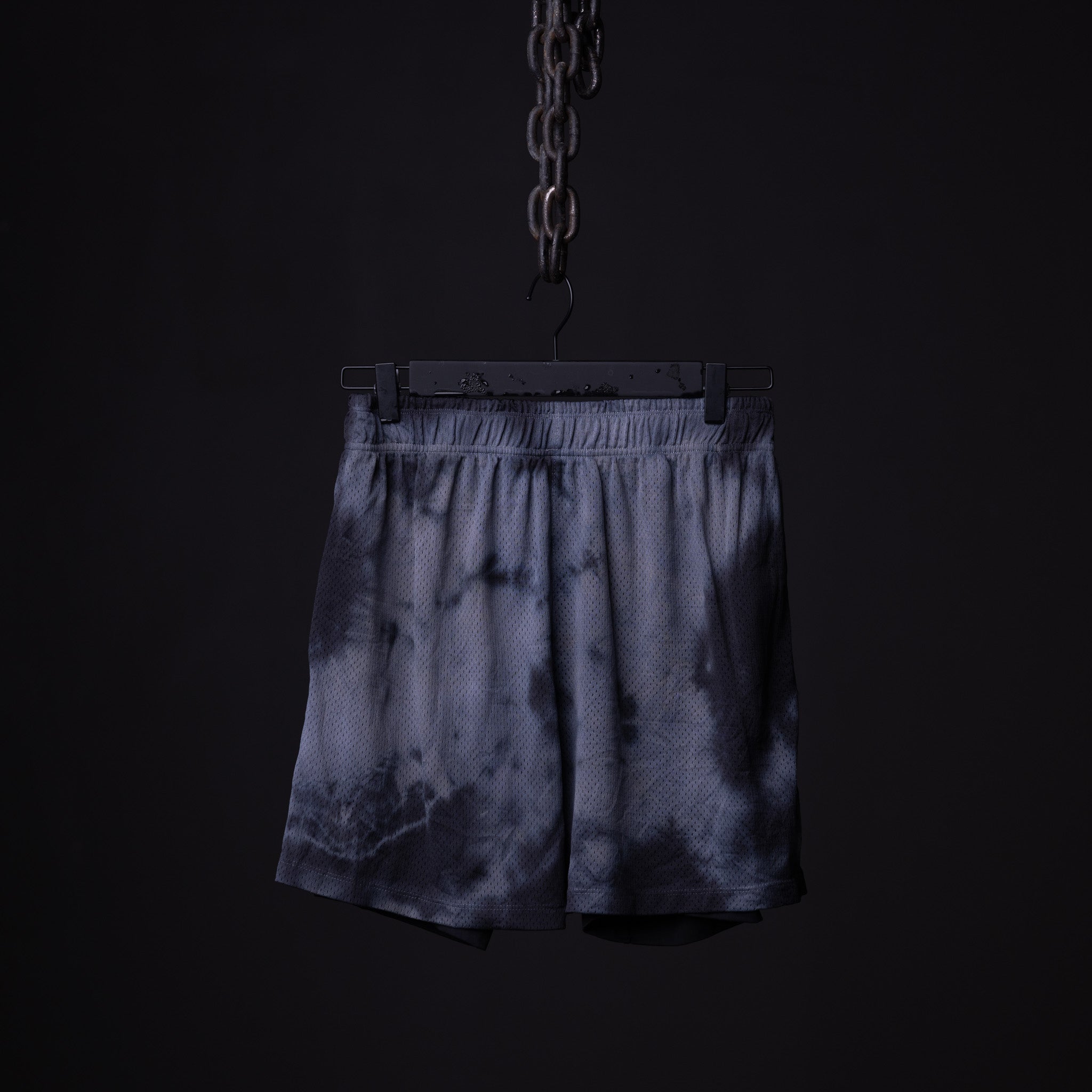 flatlay SM'21 Tie Dye Mesh Liner Short in navy tie dye, hanging display