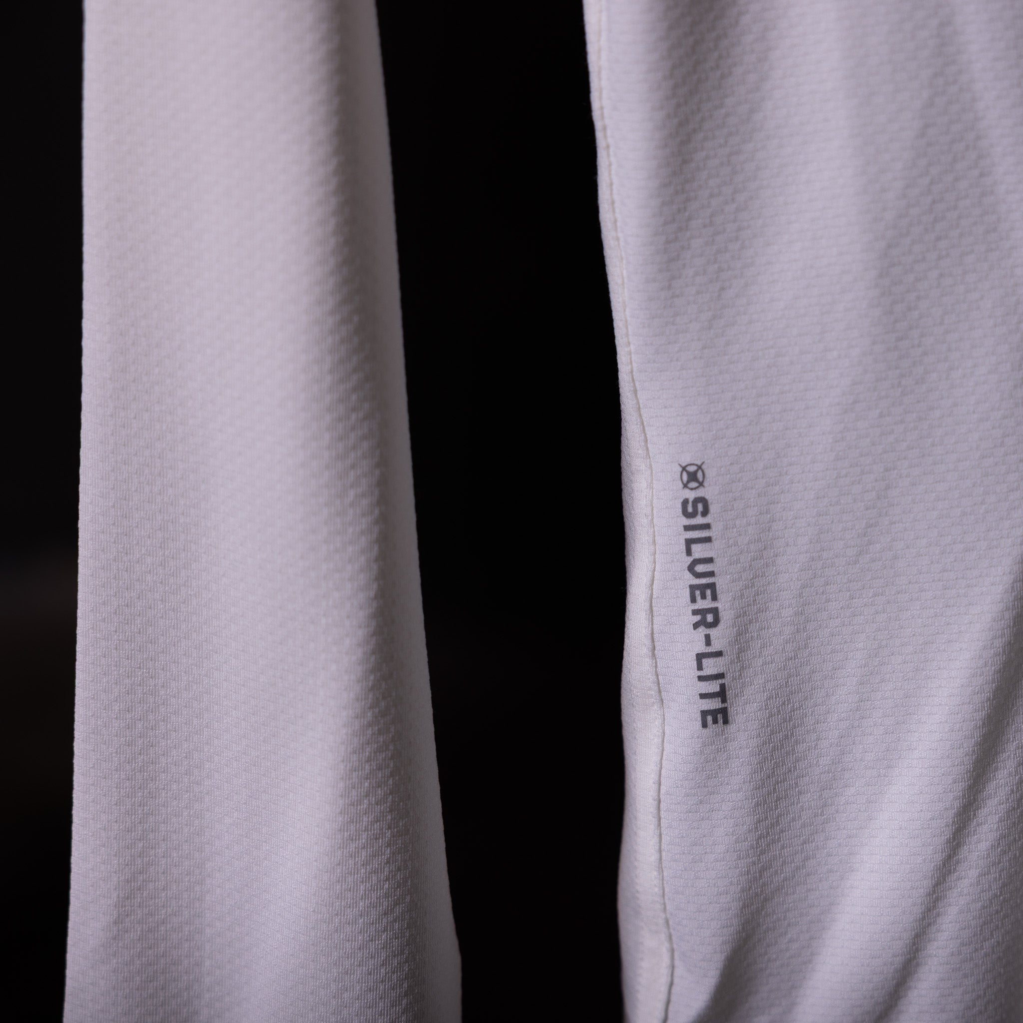 SP'20 Long Sleeve Shirt in lavender and black, detail shot showing Silver-Lite branding on sleeve