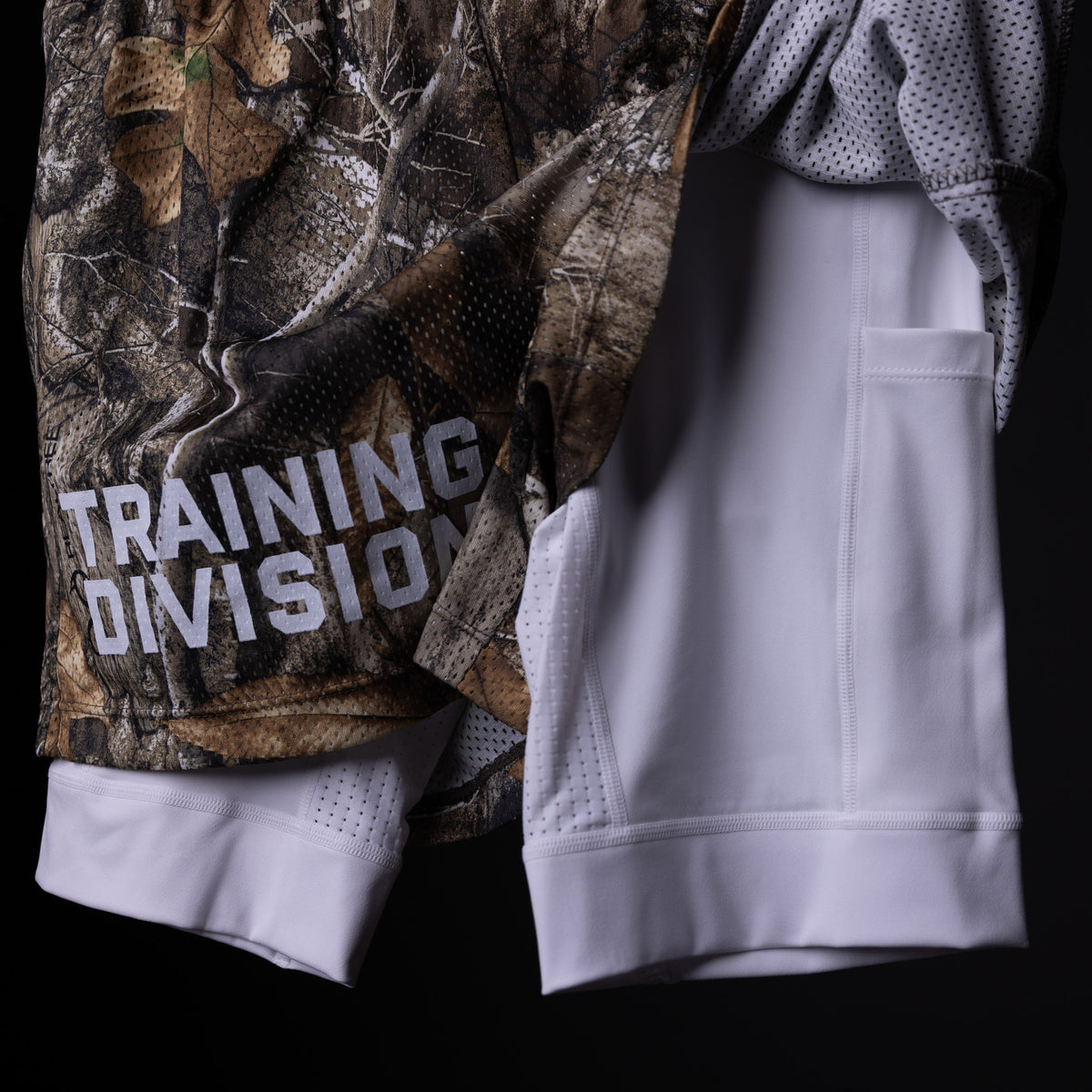 FA'23 Training Division Mesh Shorts in white and camo, worn with matching jacket detail