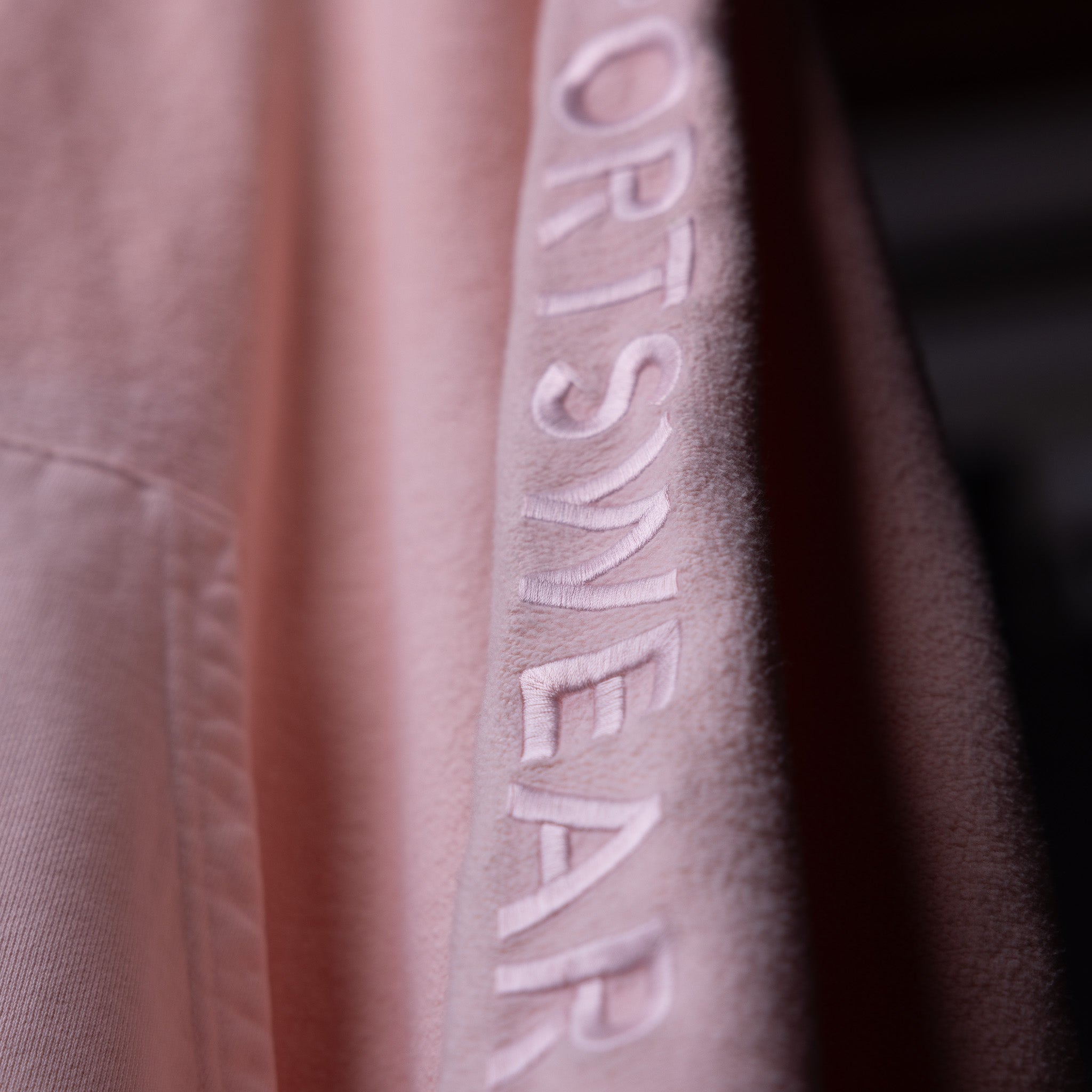 SS'20 Reverse Weave Hoodie in mauve, embroidered logo detail closeup