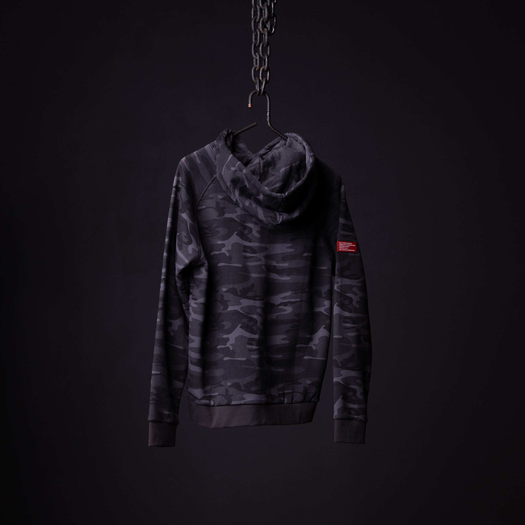 WN'19 RainPlus® Hoodie in black camo, displayed on hanger against dark background