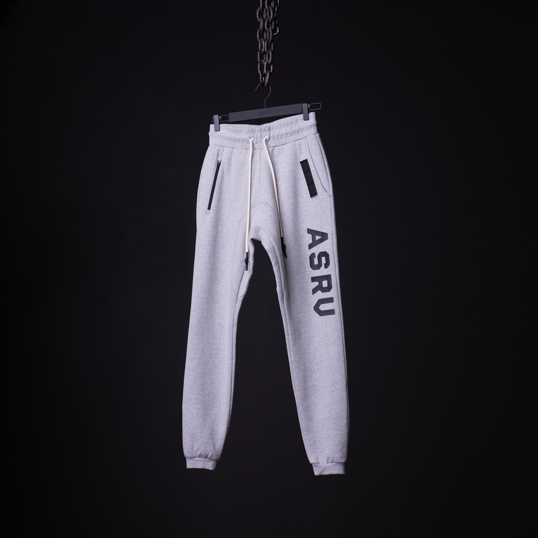 flatlay WN'19 RainPlus® jogger in light grey with ASRU branding, front view