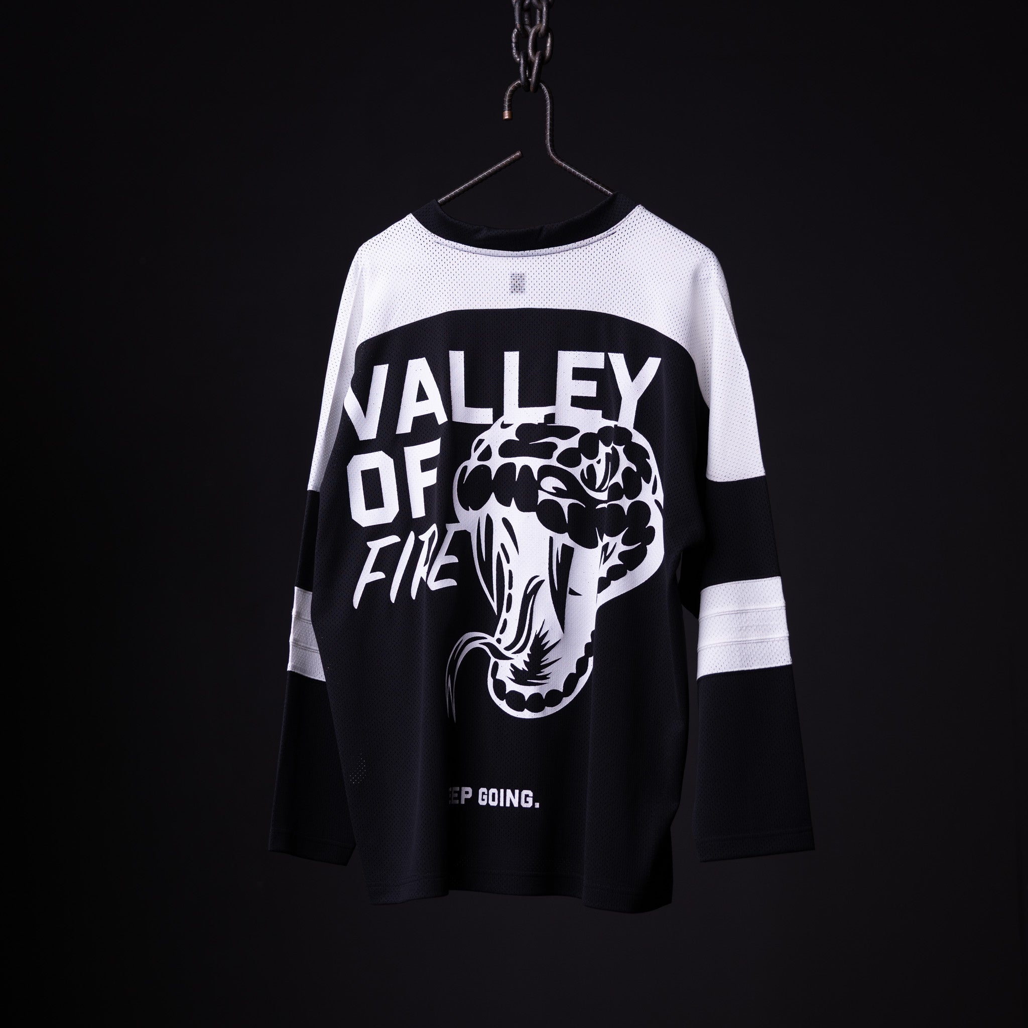 SM'23 long-sleeve jersey in black and white, hanging on hanger with 'Valley of Fine' graphic