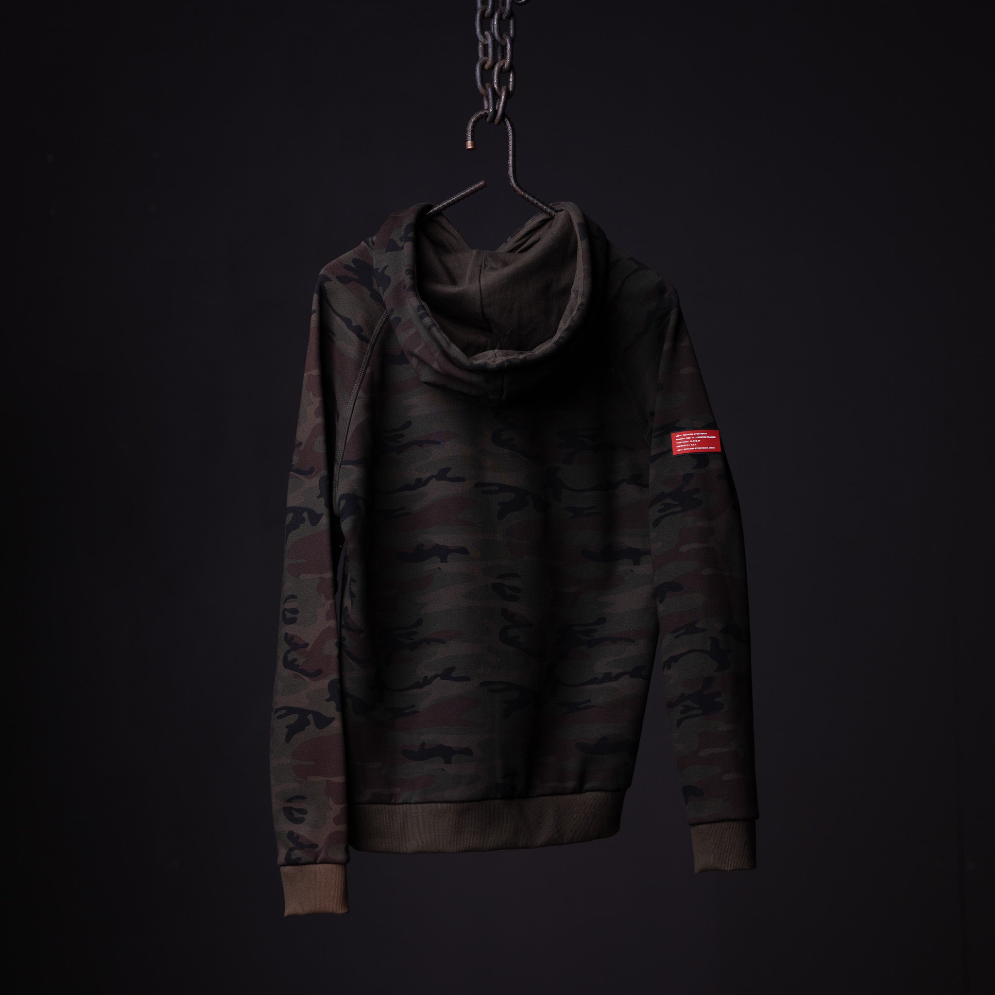 WN'19 RainPlus® Hoodie in black camo, displayed on hanger against dark background