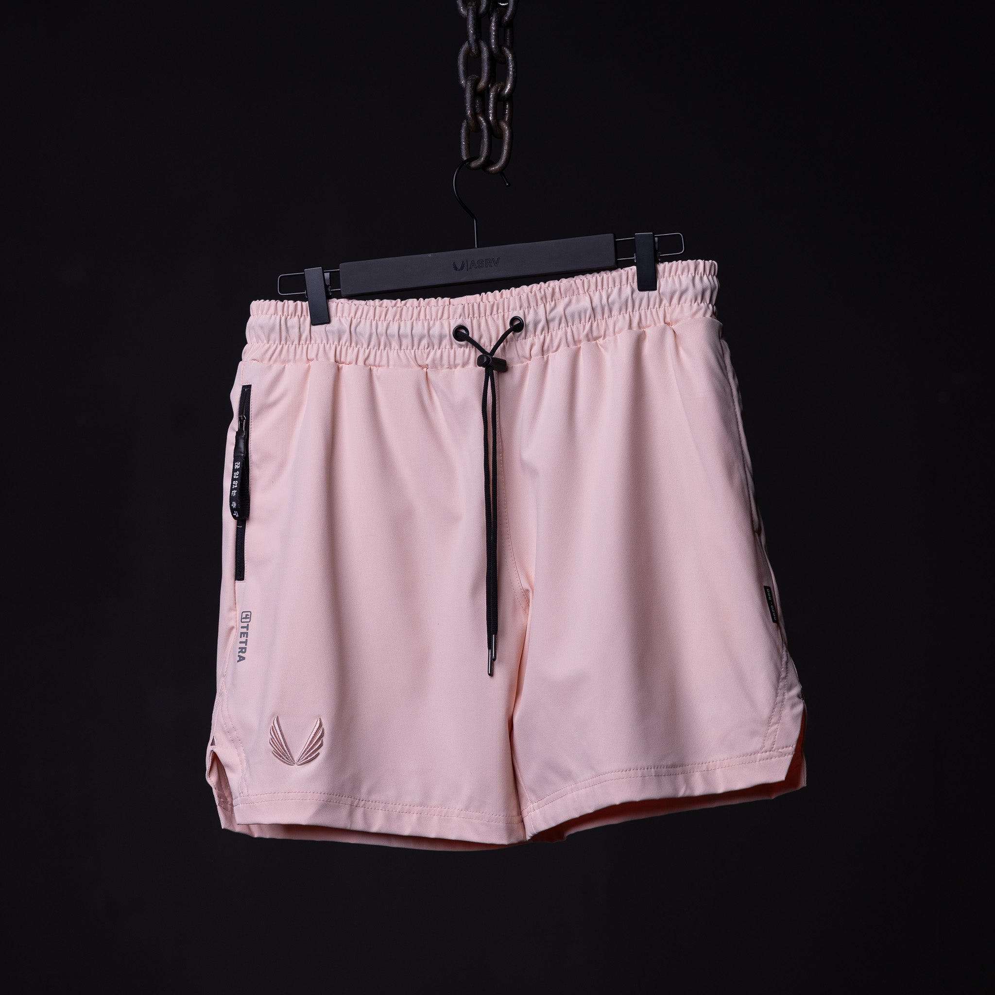 flatlay SP'21 Coastal Training Short in pink, front view on black hanger