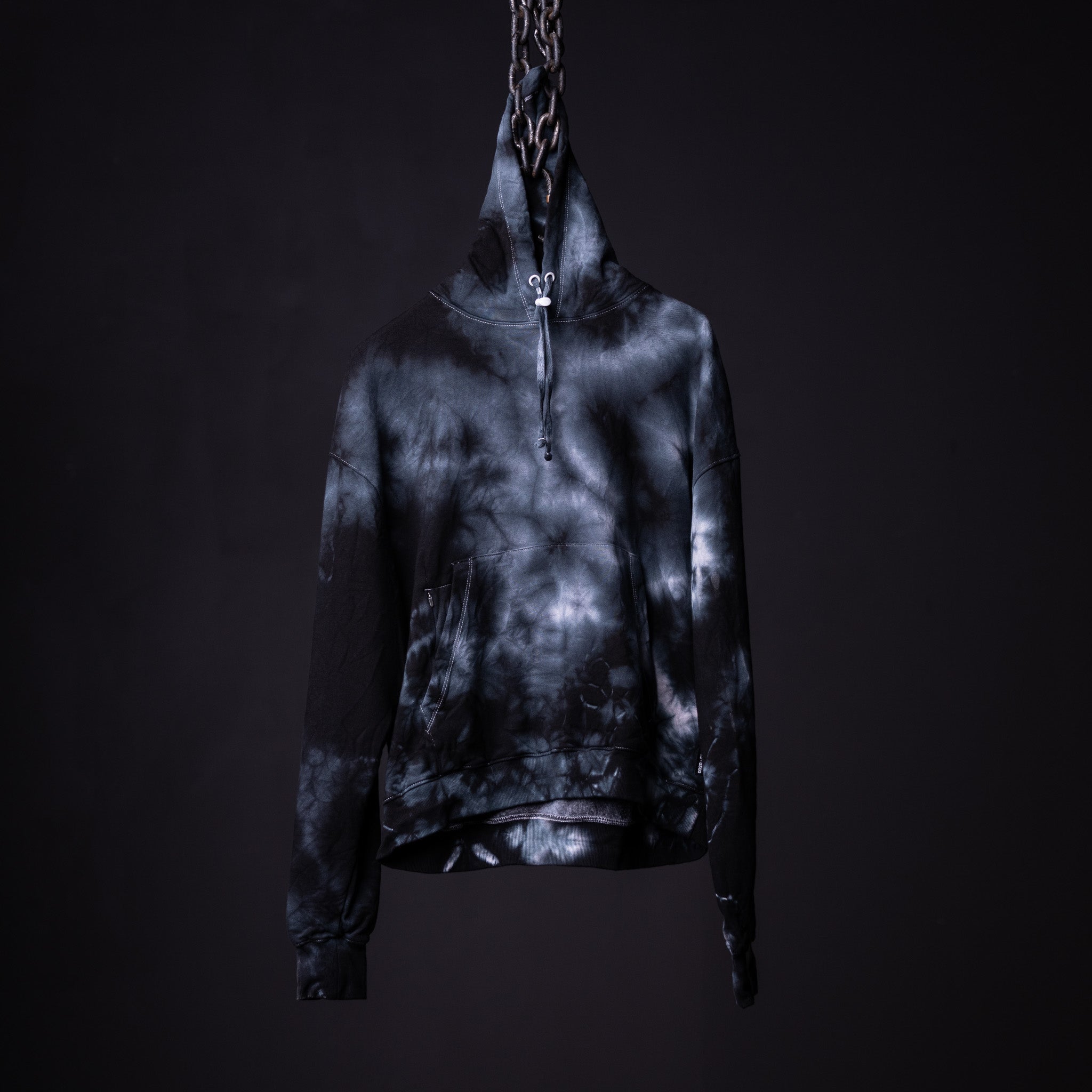 SM'22 Tie Dye Hoodie in black and white tie dye, displayed on mannequin against dark background