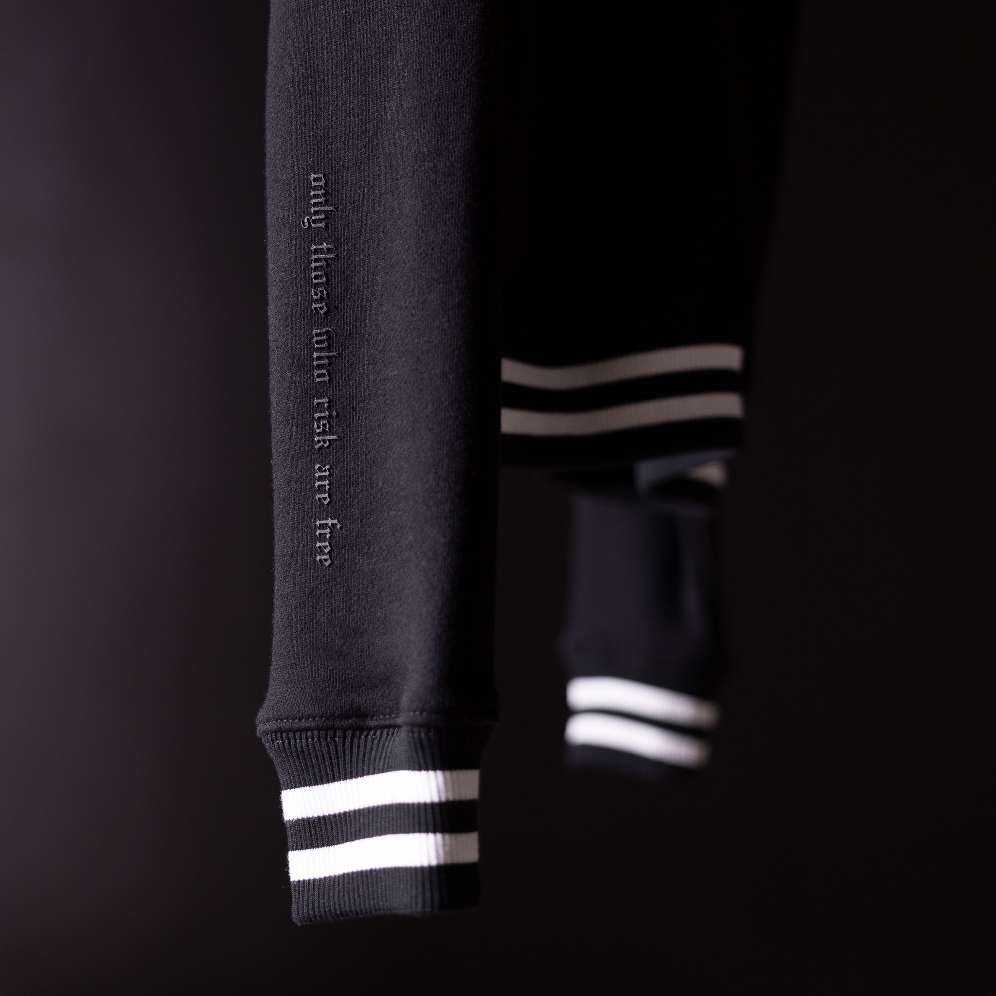 2022 Crew Neck Sweatshirt in charcoal gray with white striped cuffs, detail view