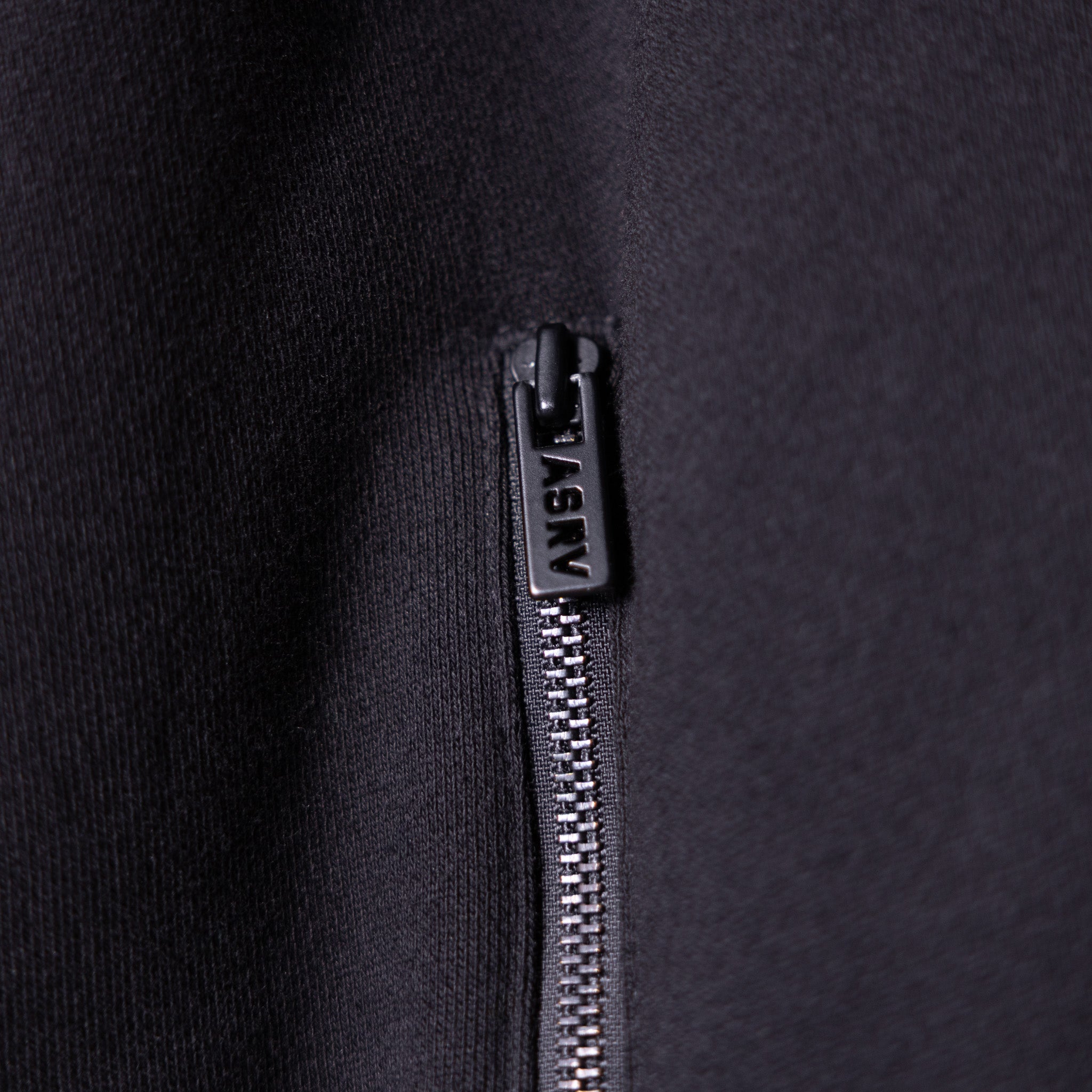 2021 Zip Pocket Quarter Zip closeup of black zipper pull and metal slider detail