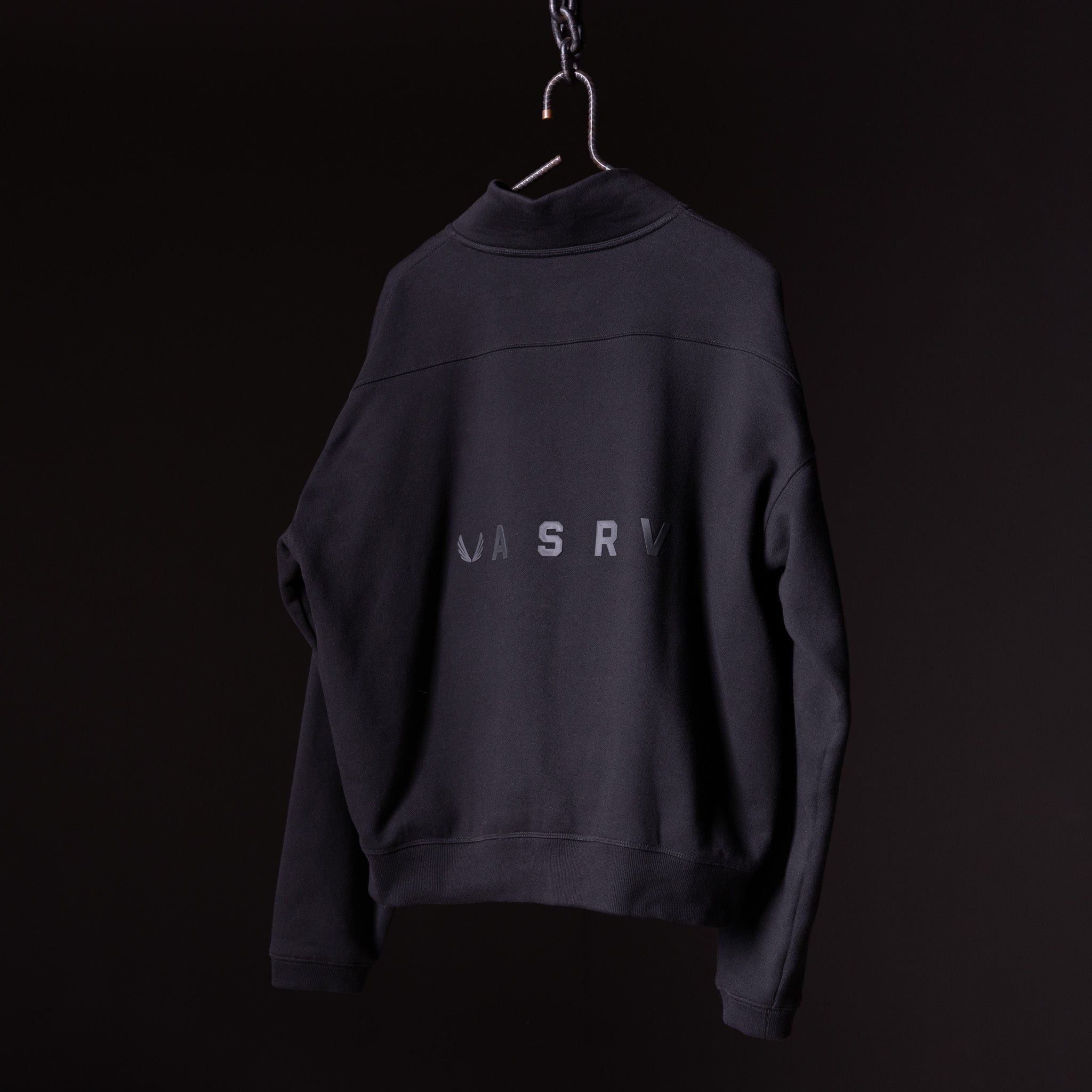 ASRV 2021 Zip Pocket Quarter Zip sweatshirt in black, displayed on hanger against dark background