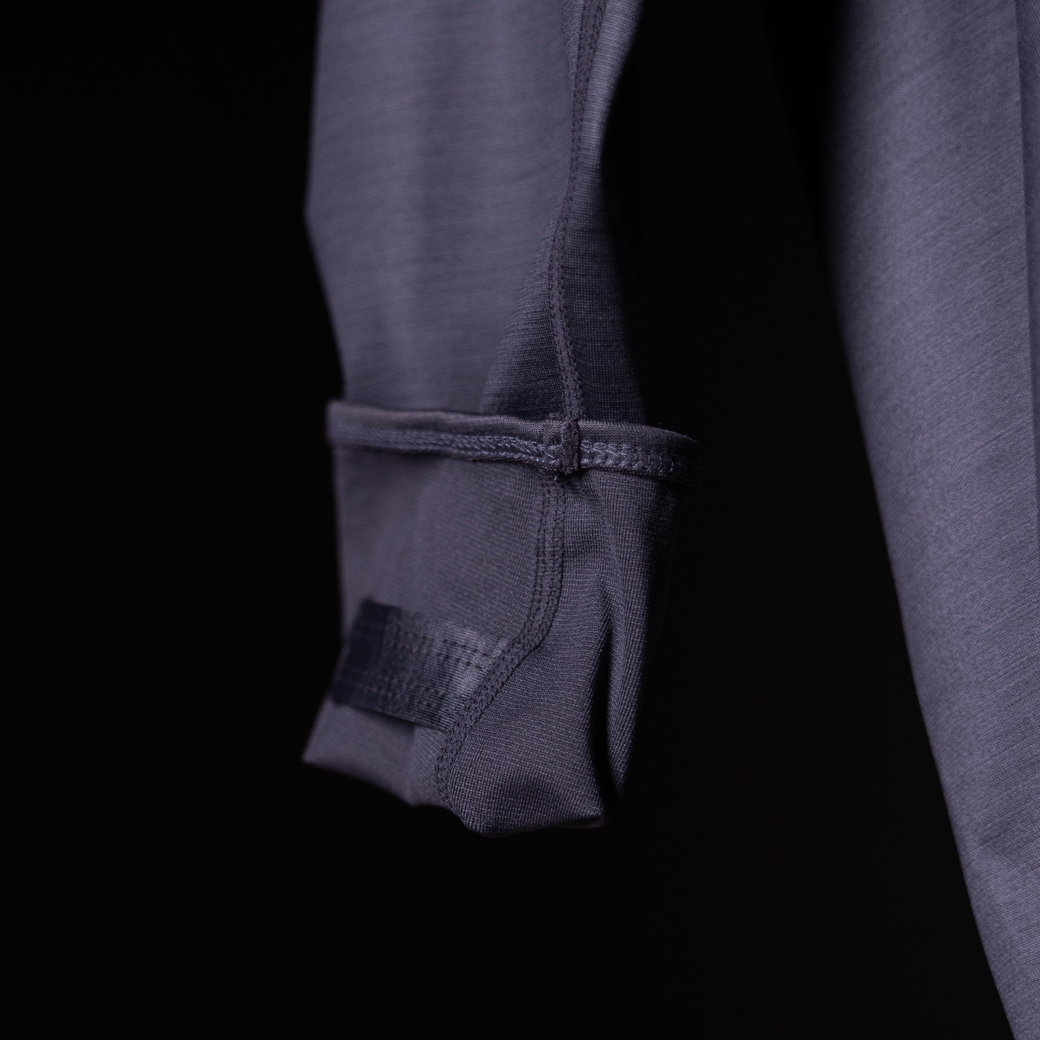 SM'18 Quarter Zip Hoodie in charcoal gray, sleeve detail closeup showing zipper and cuff