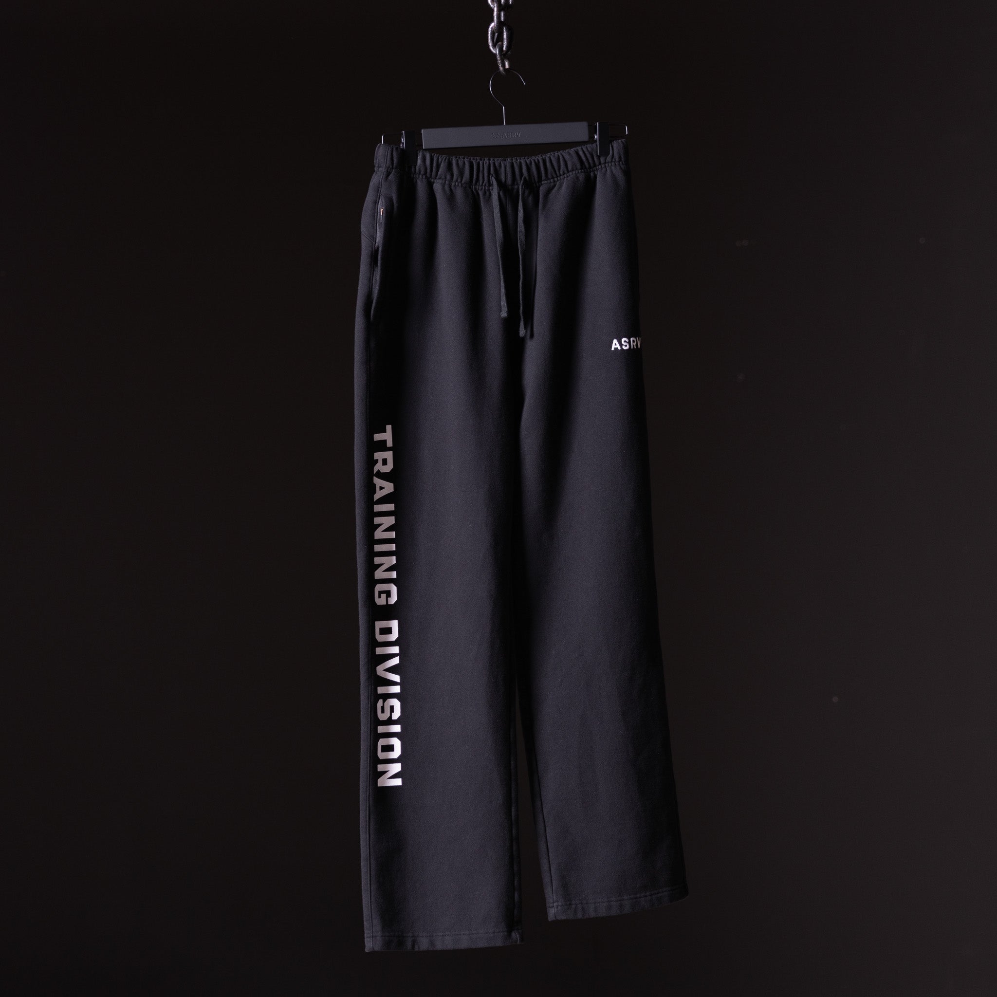 FA'23 Straight Leg Jogger in black, displayed on hanger against dark background