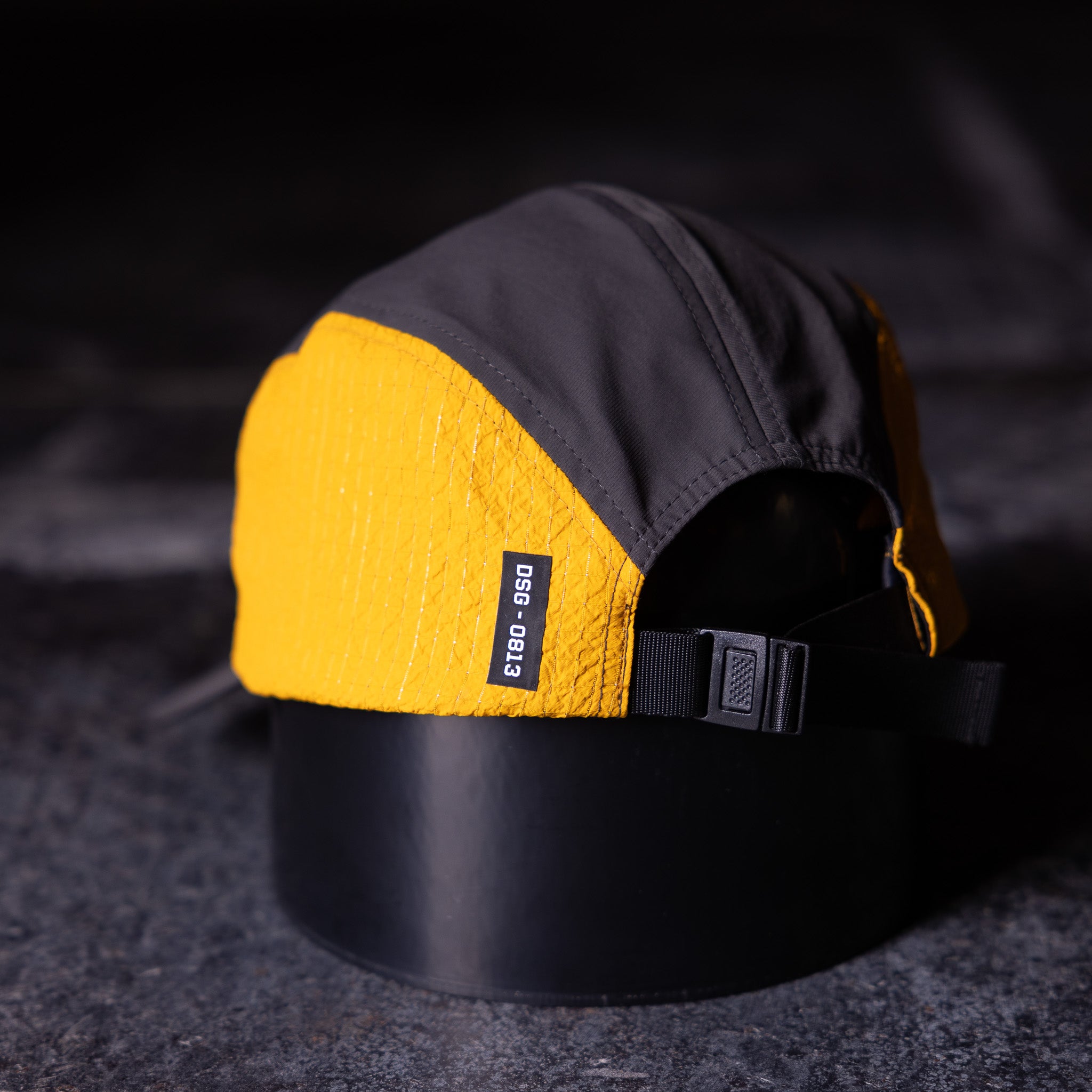 flatlay Two Tone 5 Panel Hat in yellow and black, top view