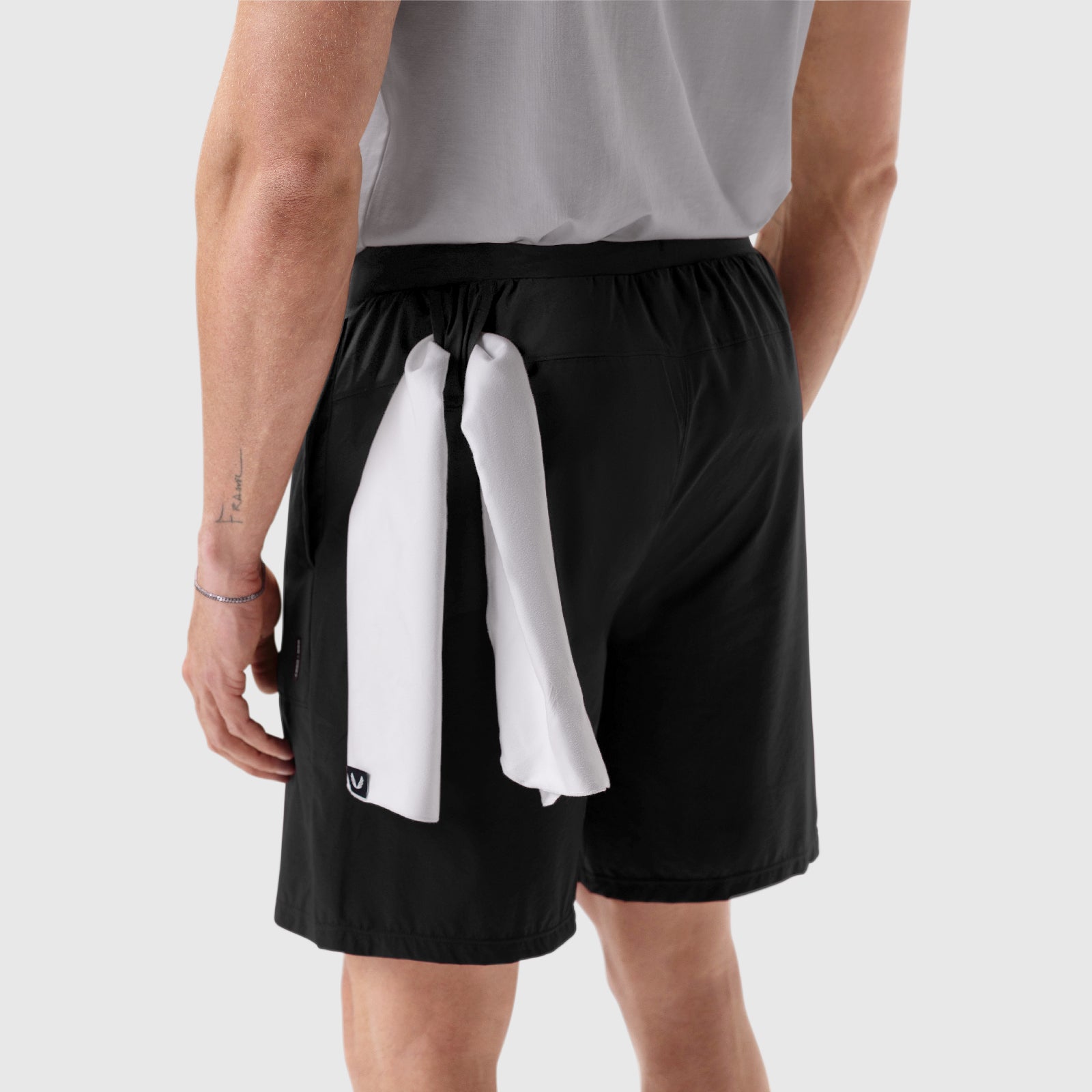 Aerotex™ 8" Training Short in black, worn by model showing back view with white towel detail