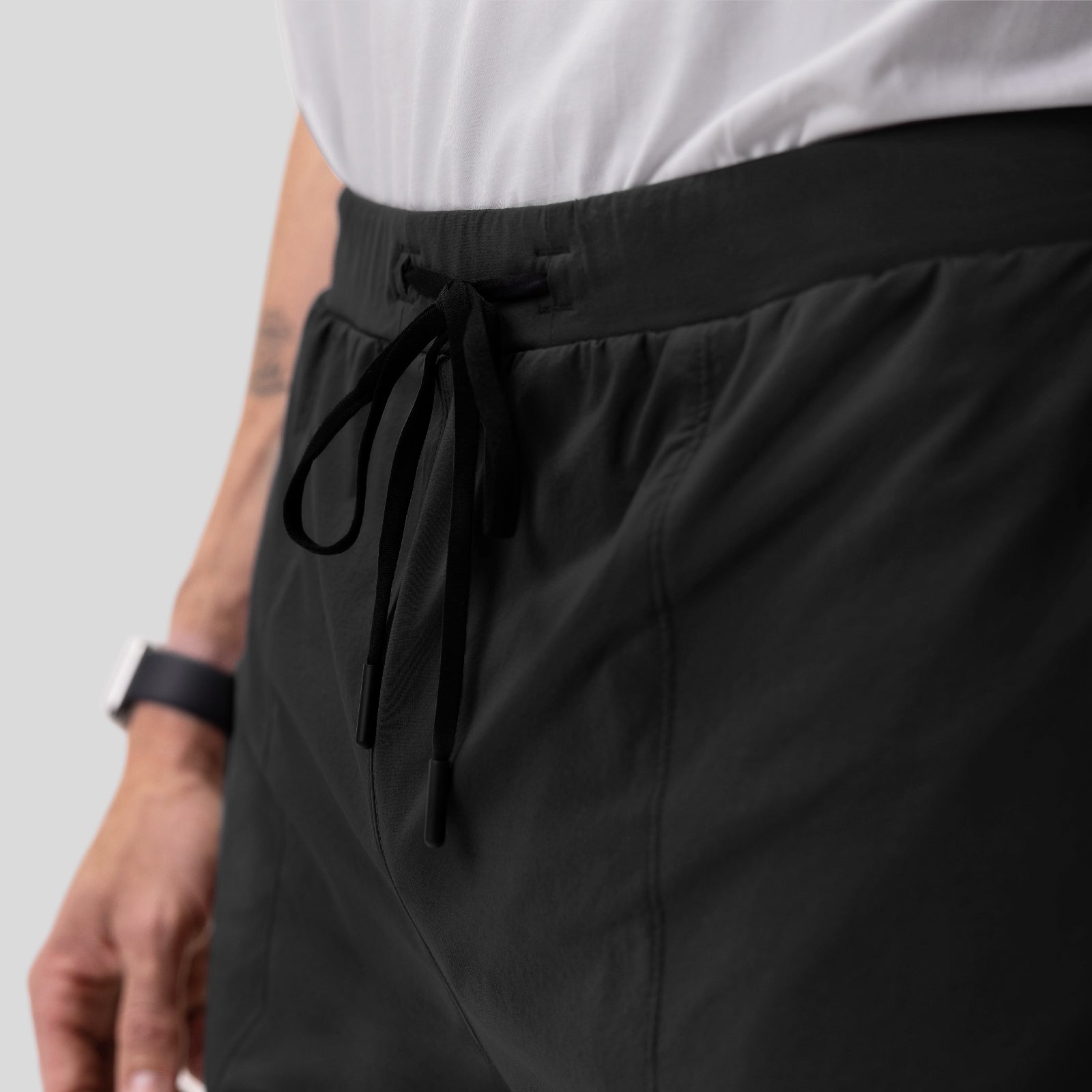 Aerotex Training Short in black, worn with drawstring detail visible on model