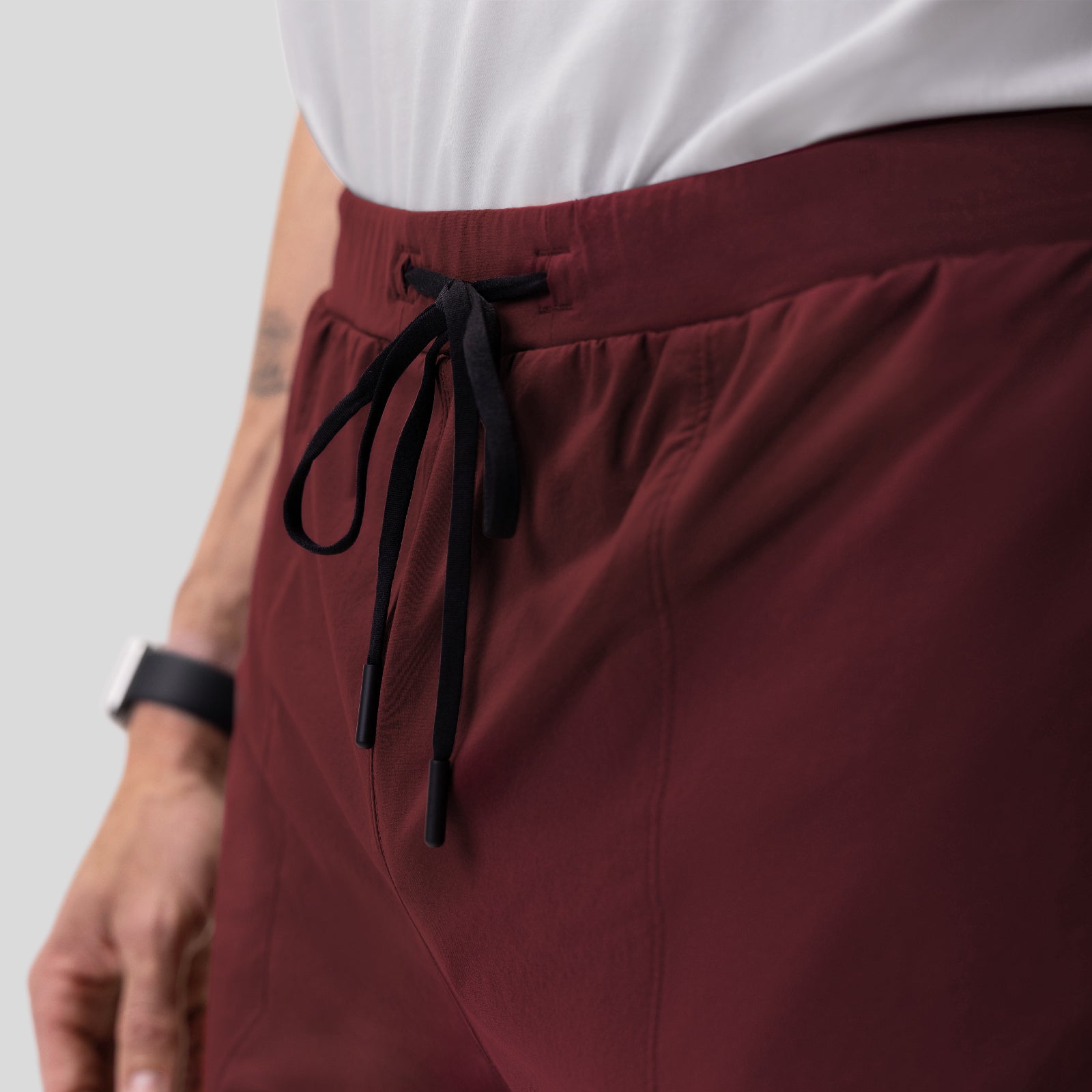 Aerotex Training Short in crimson, worn with drawstring detail closeup