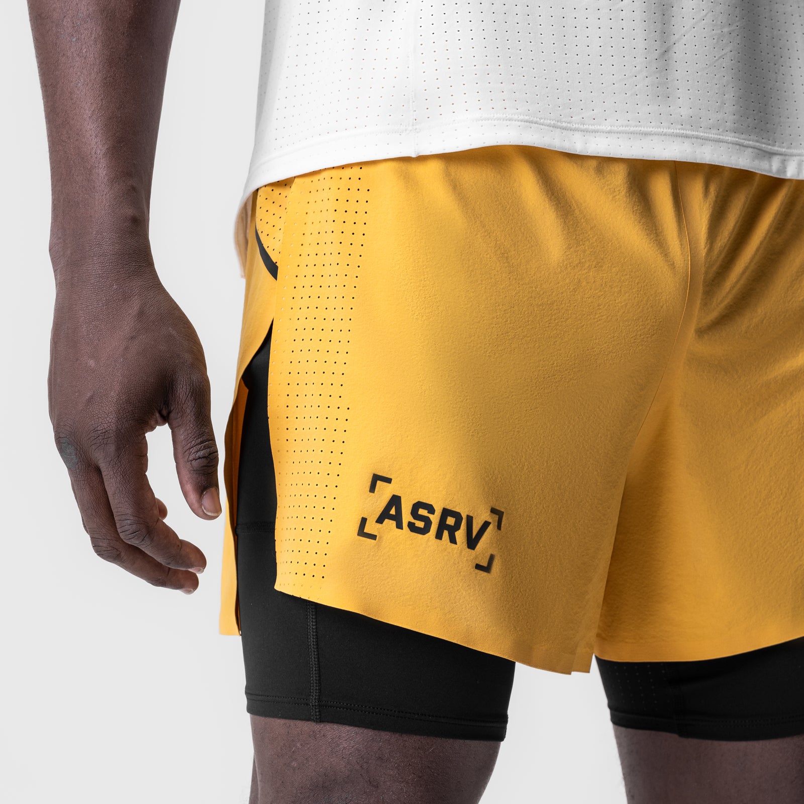 Aerotex 4" High Split Liner Short in amber, modeled from side waist down