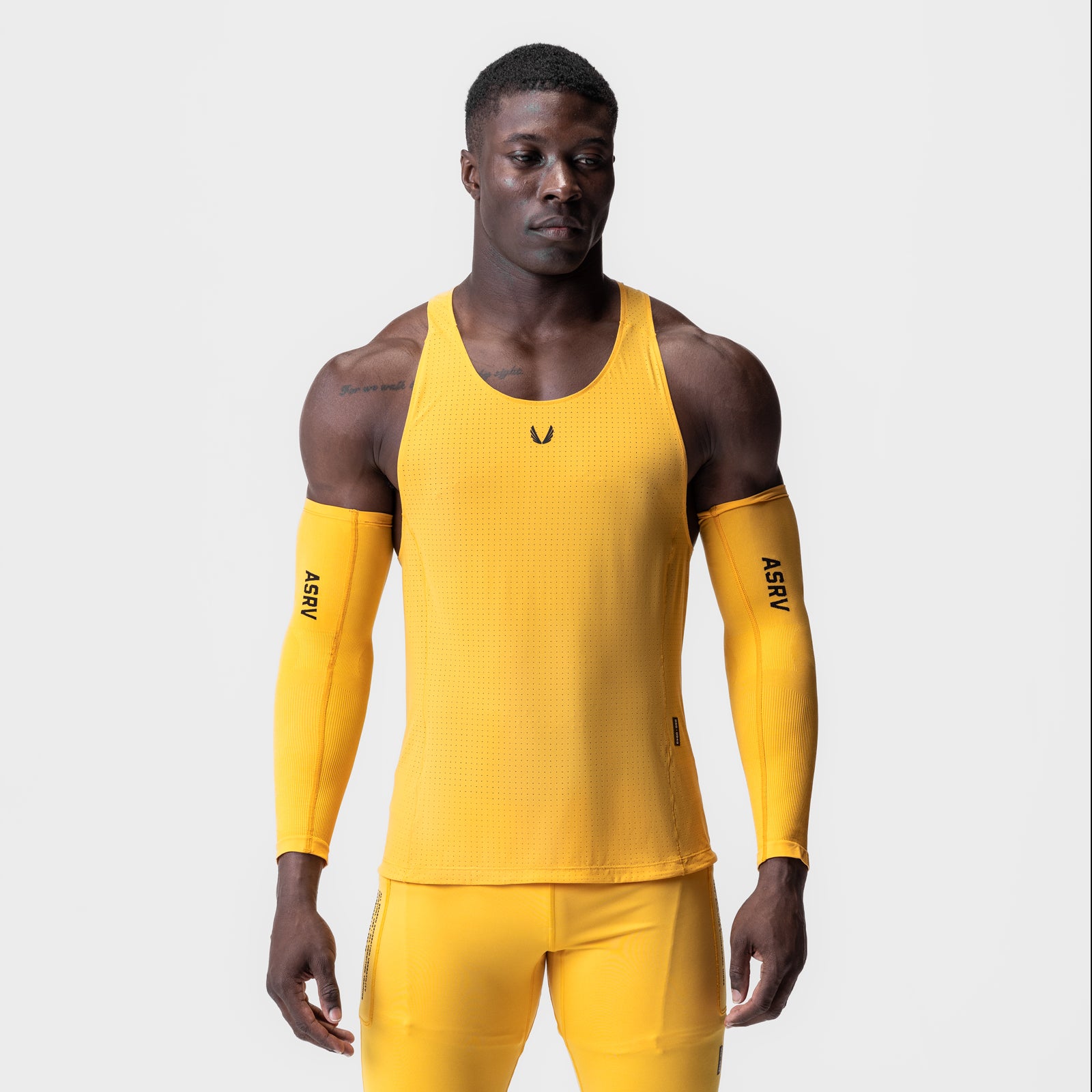 Laser-Vent™ Singlet Tank in amber yellow with matching arm sleeves, front view on model