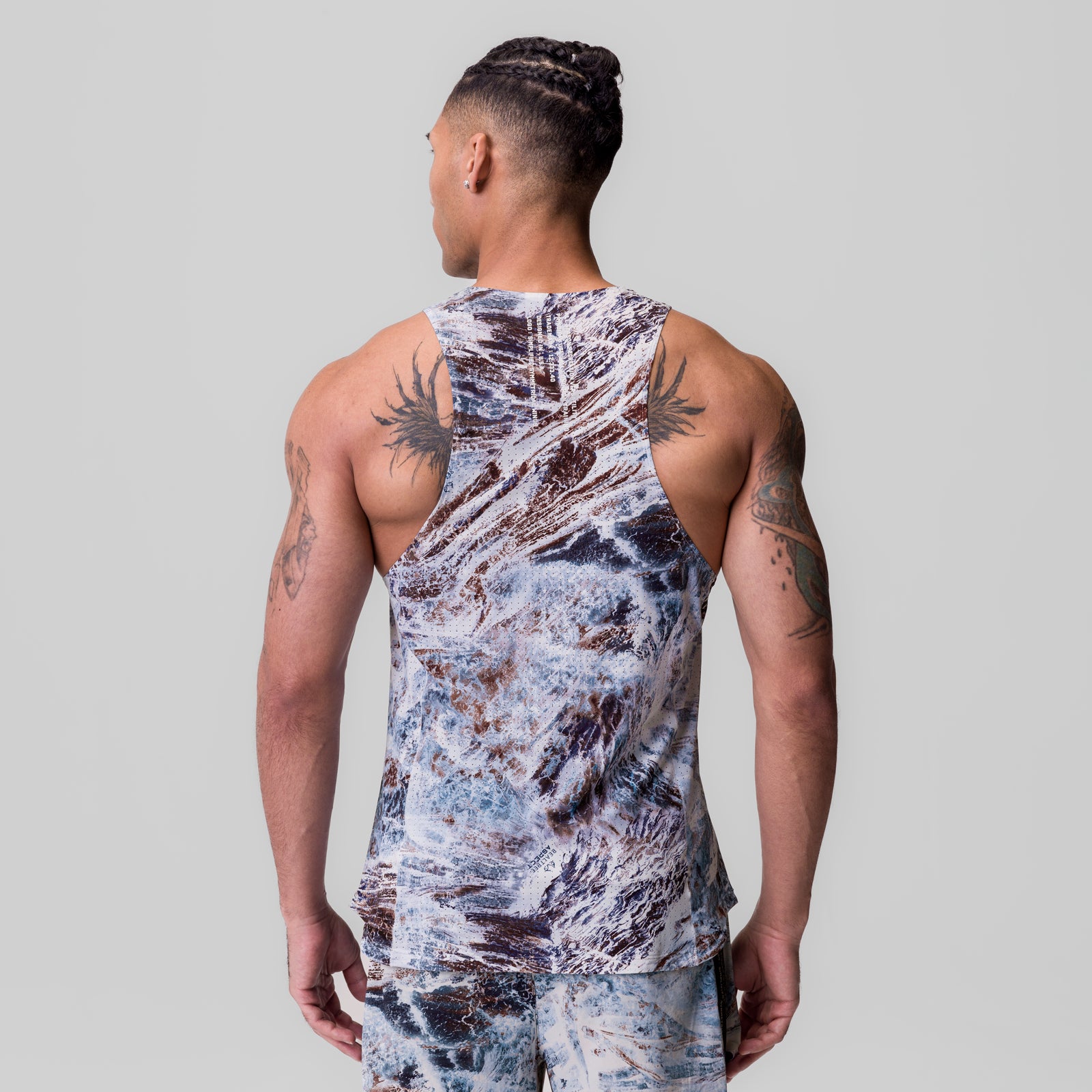 Laser-Vent™ Singlet Tank in blue marble print, worn by model showing back view