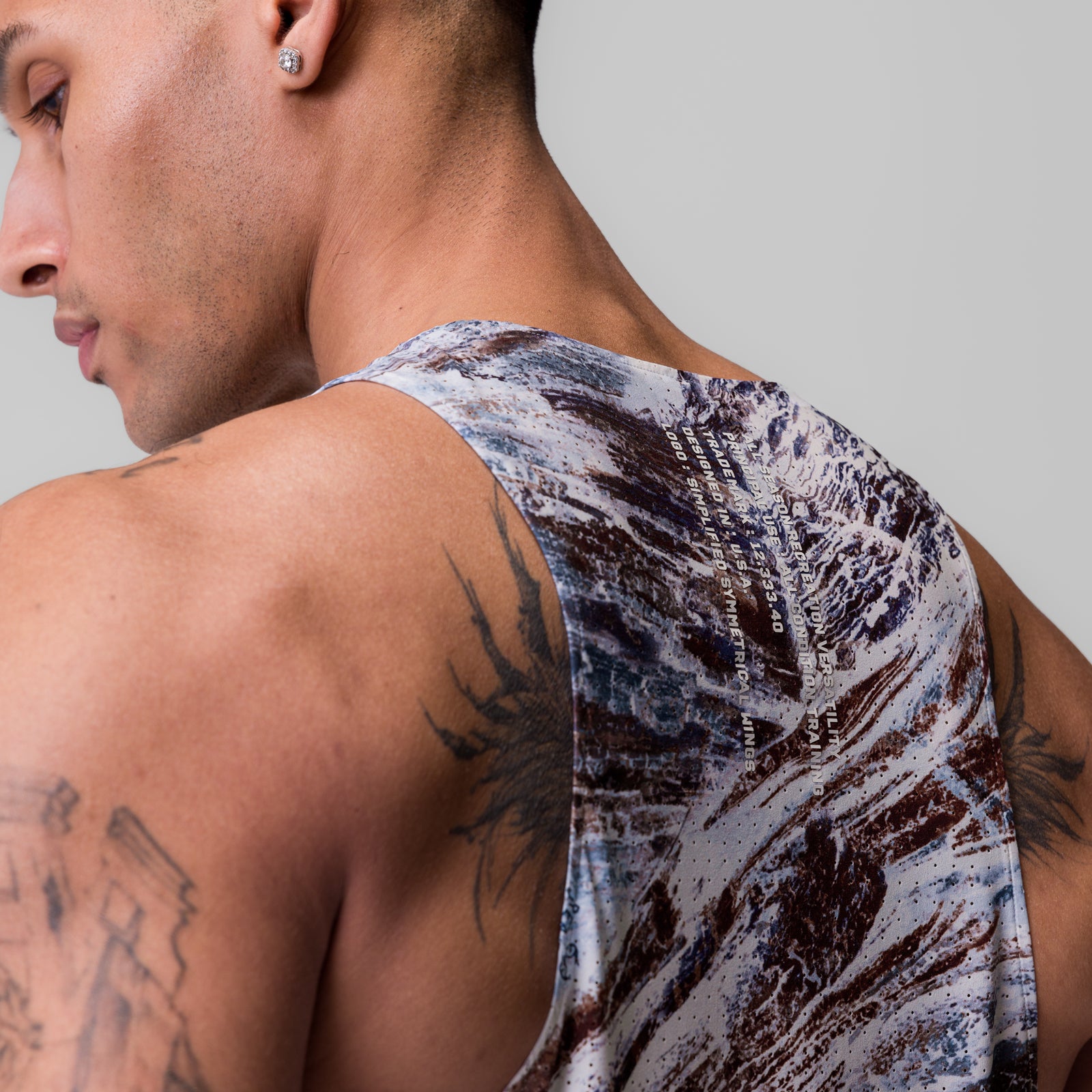 Laser-Vent™ Singlet Tank in blue/brown camo print, worn by model, side view