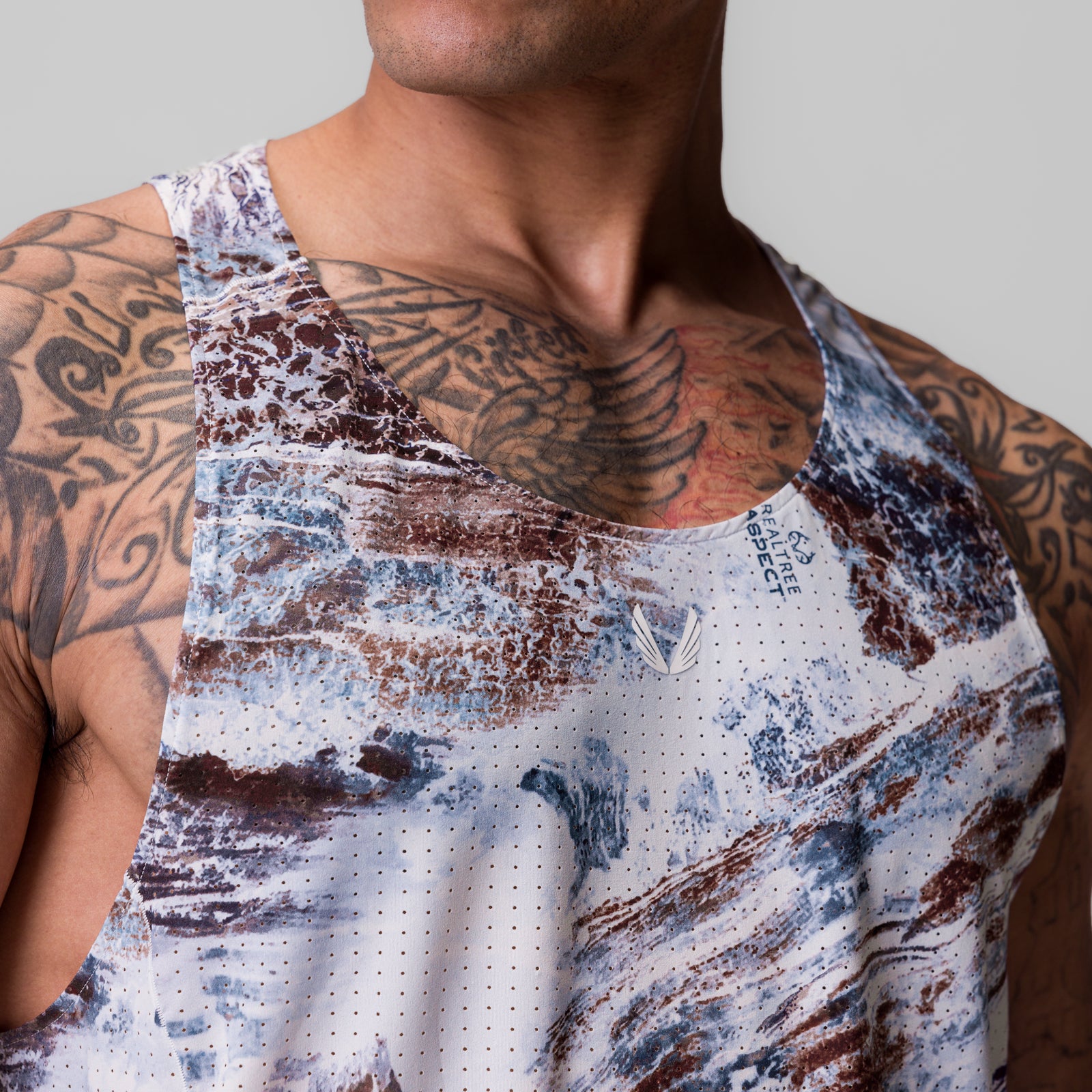 Laser-Vent Singlet Tank in blue and brown camo print, worn by model showing front view