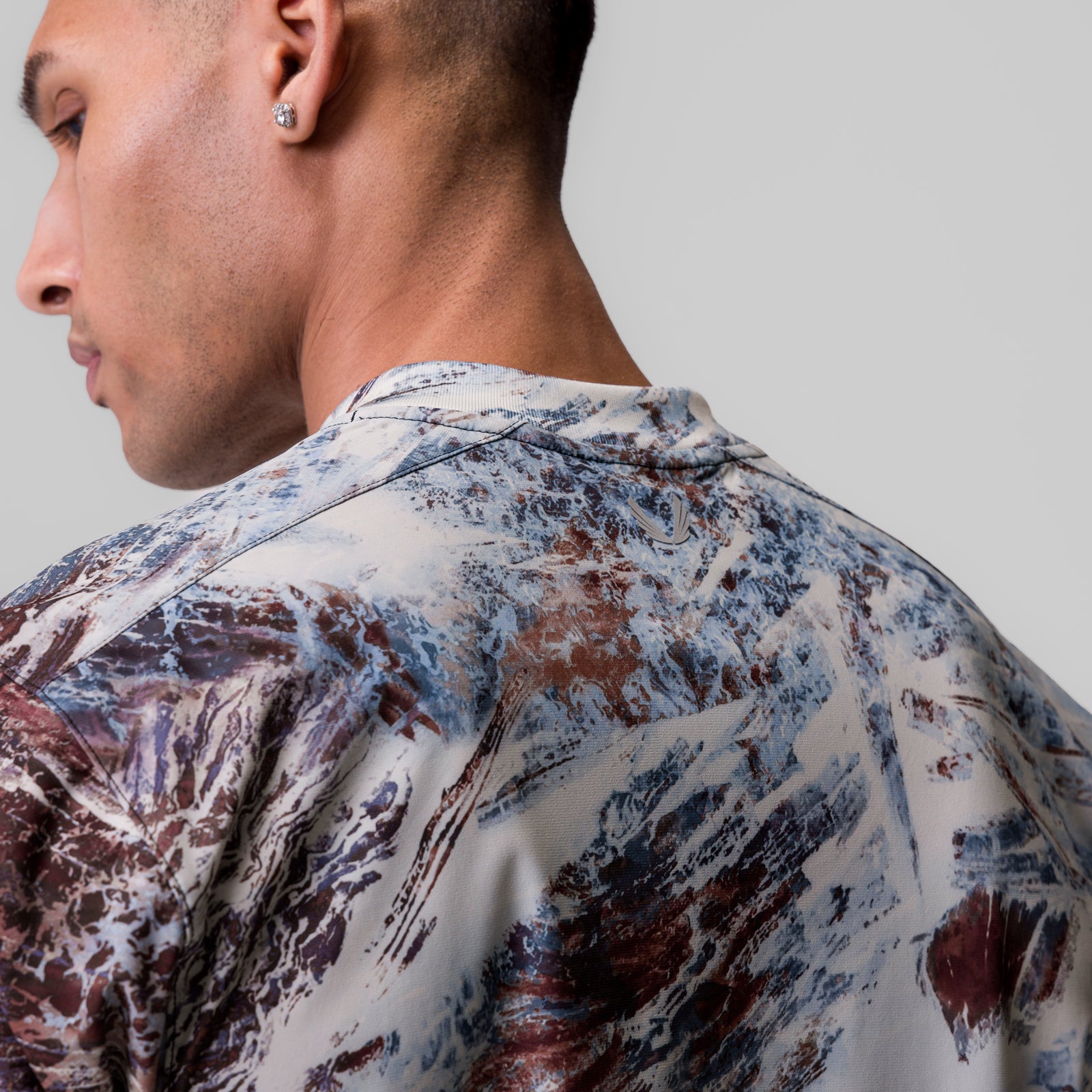 Tetra-Lite Ice Zip Tee in Realtree Aspect camo, worn by model, back view
