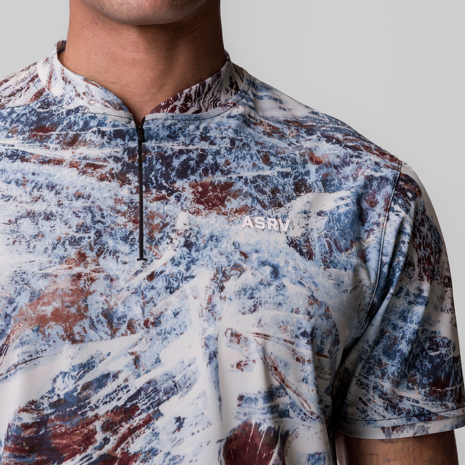 Tetra-Lite Ice Zip Tee in blue, red, and white Realtree Aspect camo, worn by model