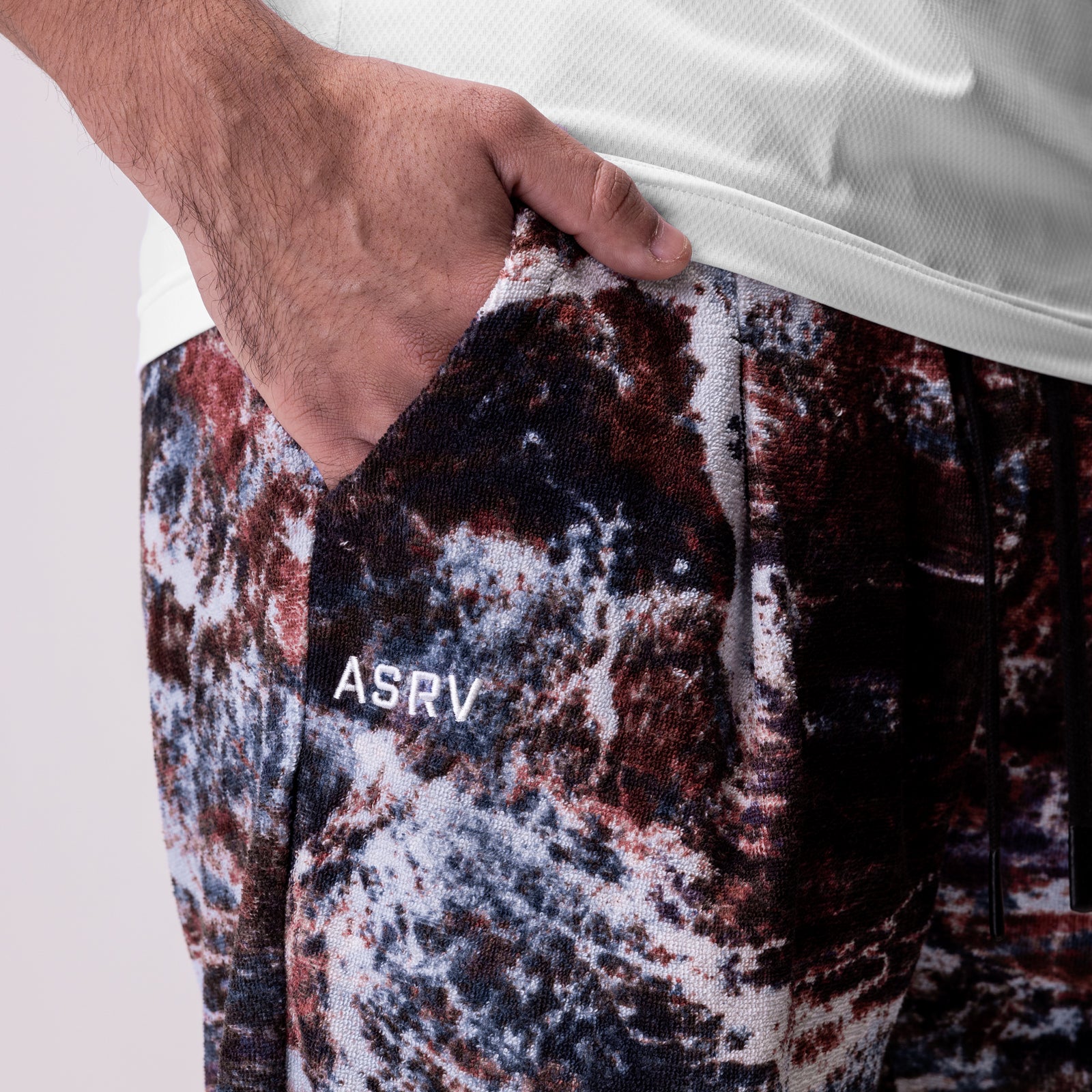 Towel Terry Relaxed Short in burgundy camo print, worn by model showing side pocket detail