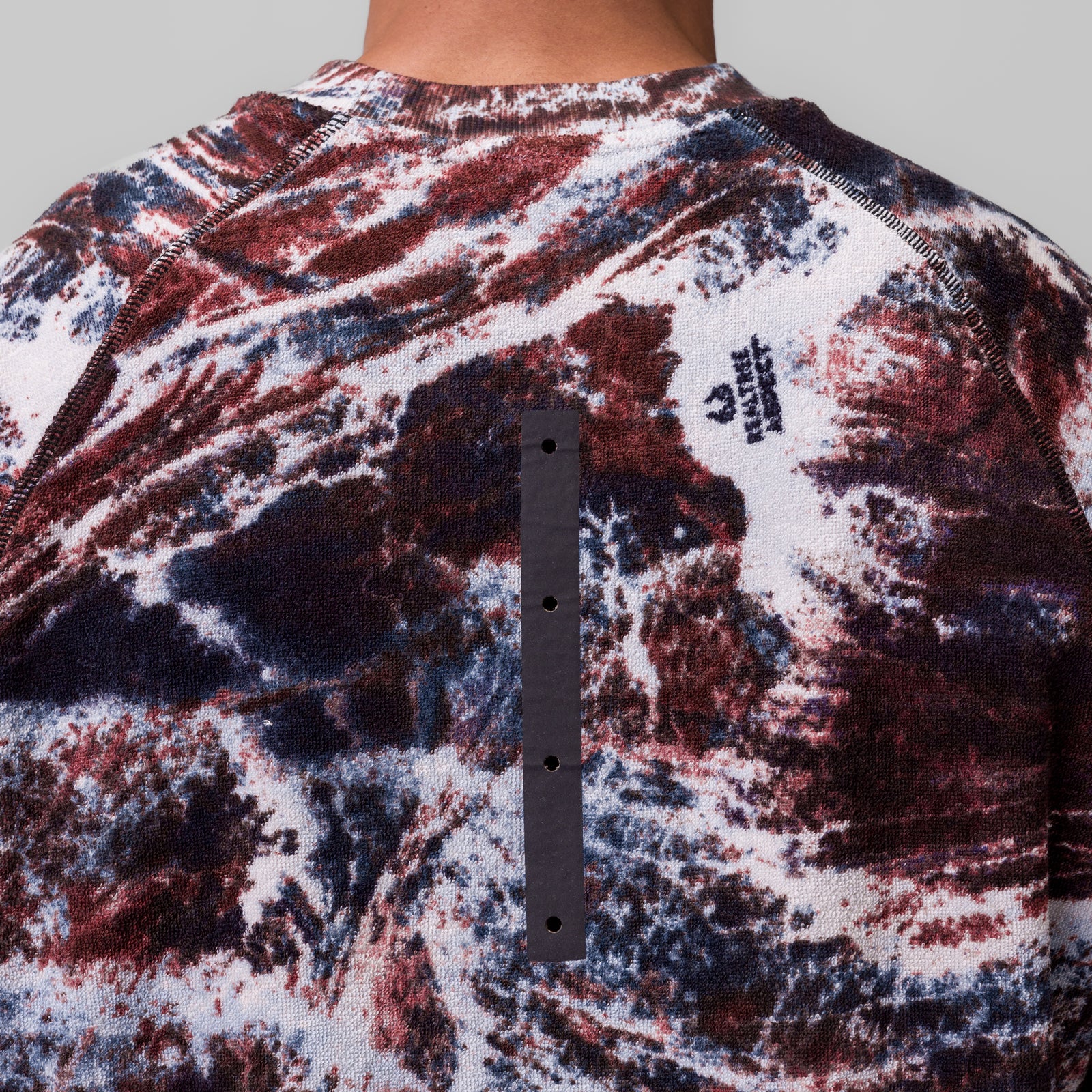 Towel Terry Cutoff in burgundy/navy camo print, back view on model