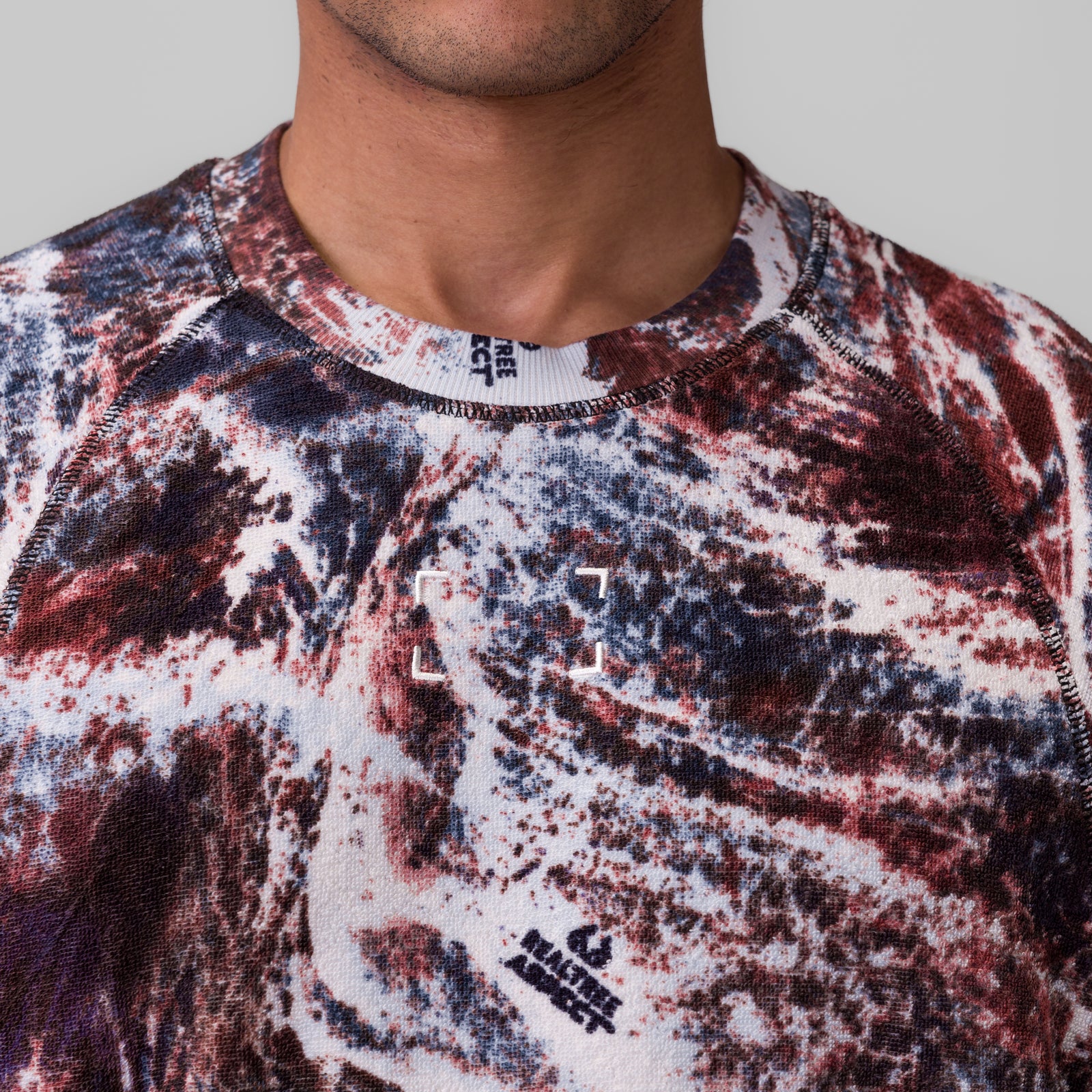 Towel Terry Cutoff in red, white, and navy camo print, worn by model