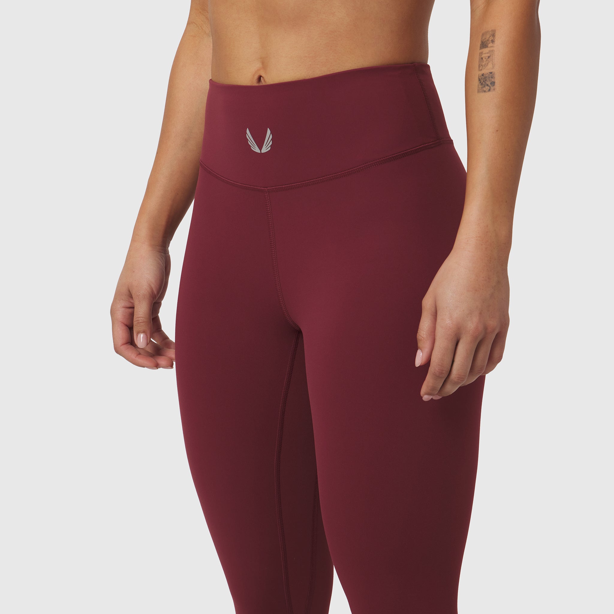 W002 LYCRA® ADAPTIV legging in crimson, worn on model, front view