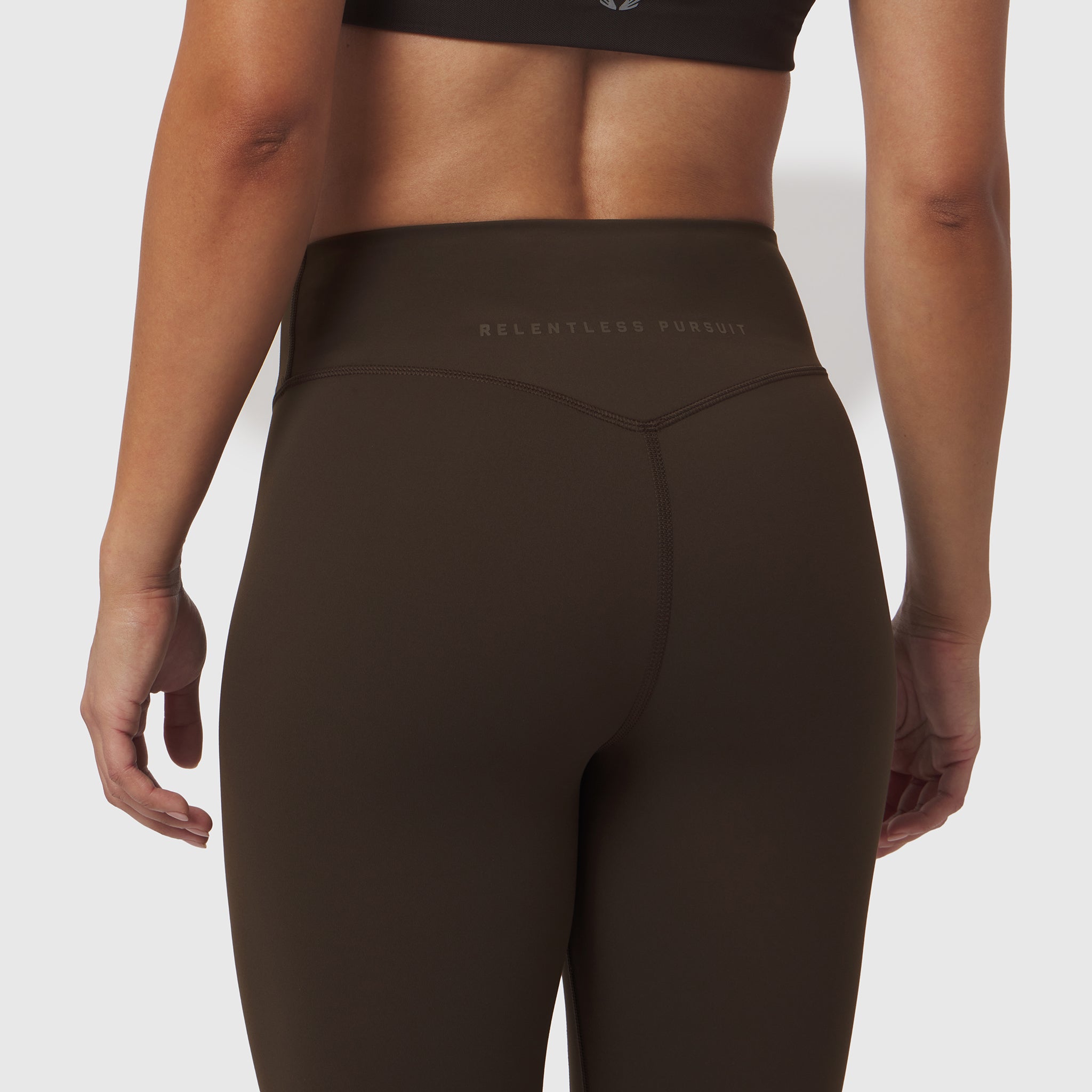 W002 LYCRA® ADAPTIV Legging in Dark Earth, rear view on model