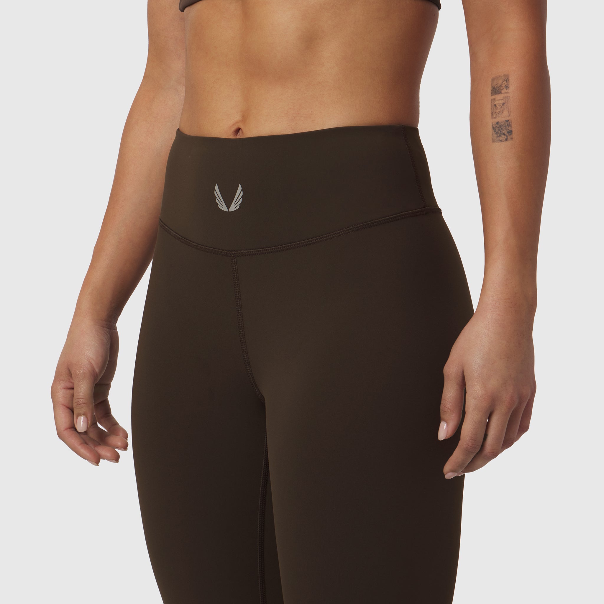 W002 LYCRA® ADAPTIV Legging in Dark Earth, worn by model, front view