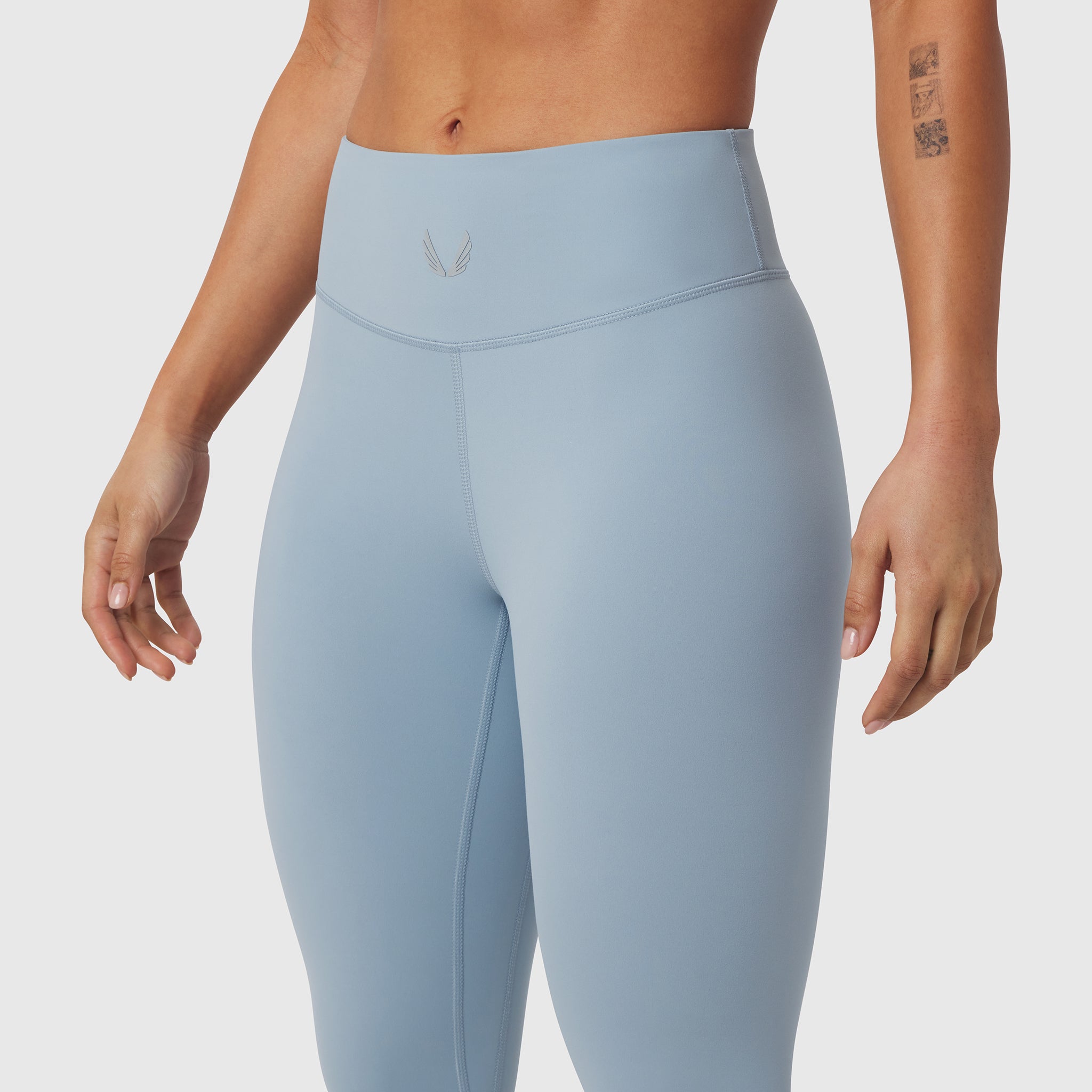 W002 LYCRA® ADAPTIV Legging in light sky, worn by model, front view