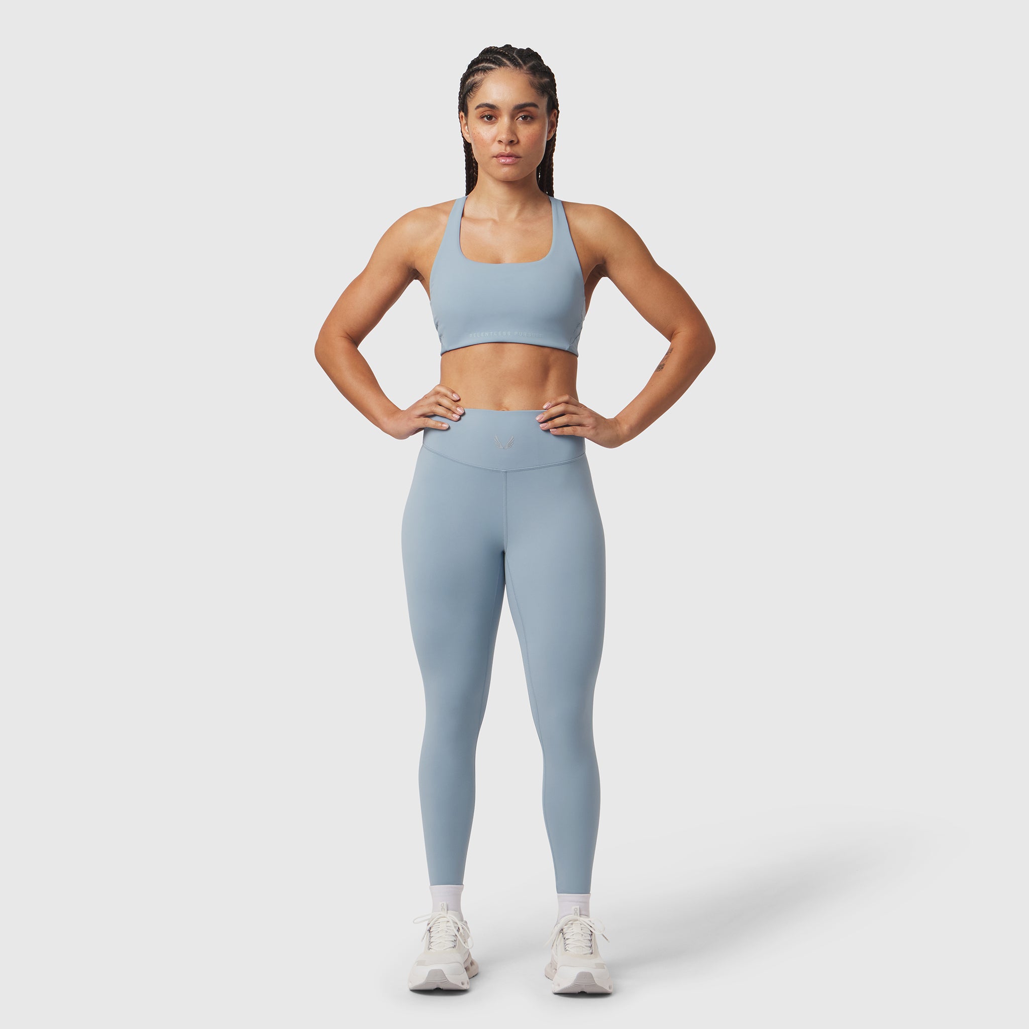 W002 LYCRA® ADAPTIV Legging in light sky, worn by model standing facing camera